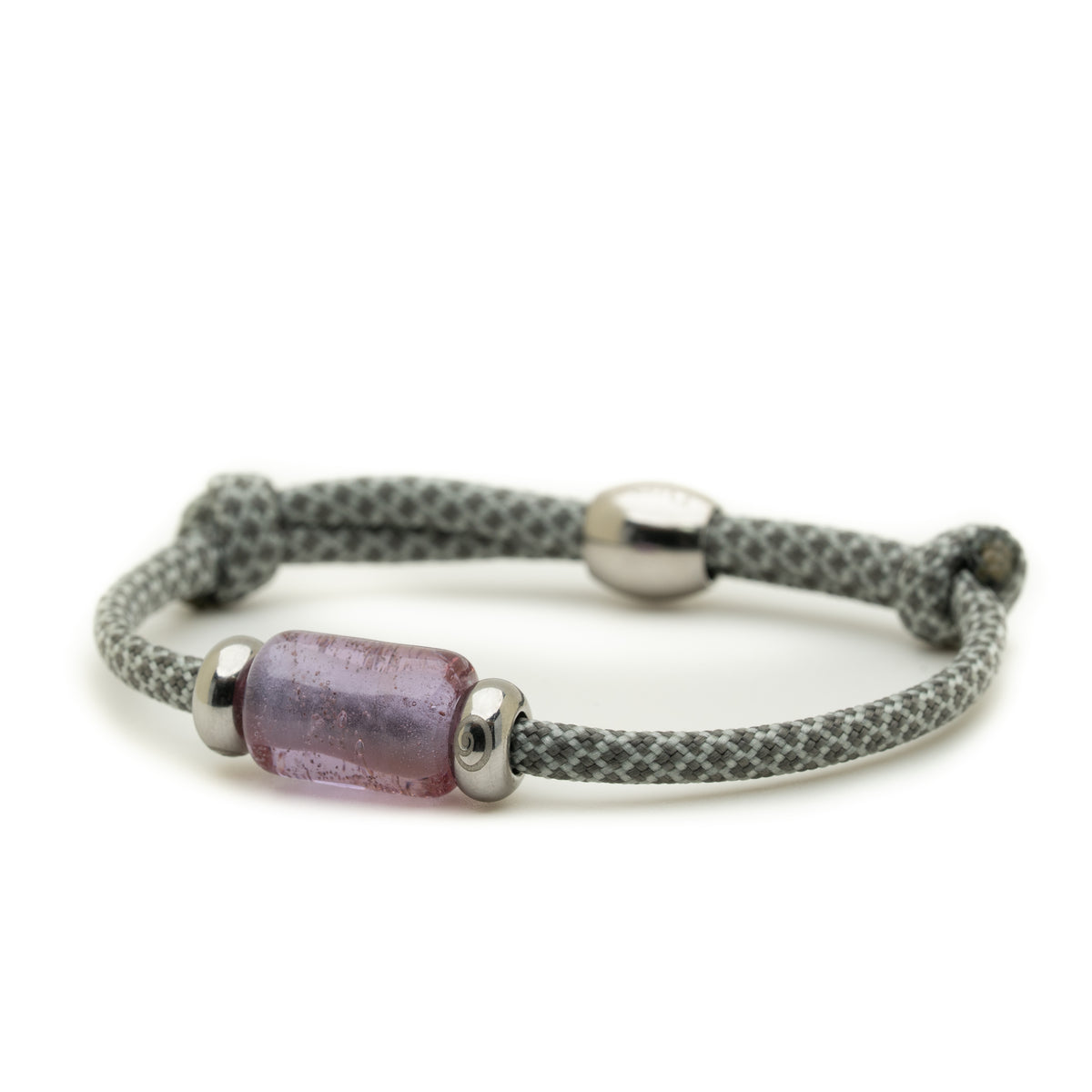 A gray and white patterned cord bracelet with a central lavender-purple translucent bead and silver-toned metal caps, shown on a plain white background.