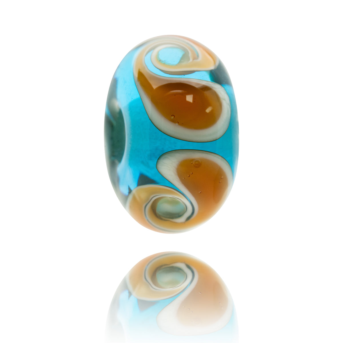 A single oval glass lampwork bead with a swirl pattern of bright turquoise blue, amber brown, cream, and white, shown on a clean white background with a soft reflection below.