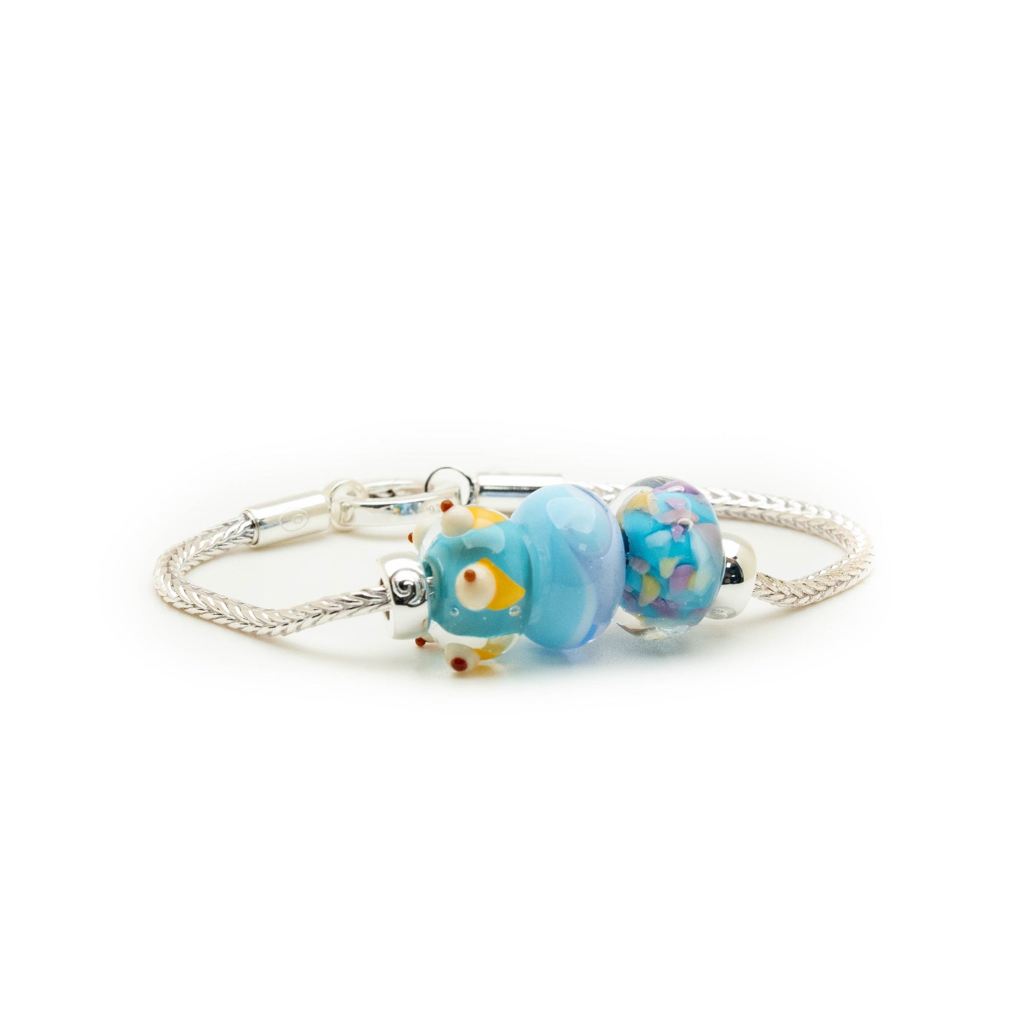 Blue glass beads for Kent on silver bracelet.