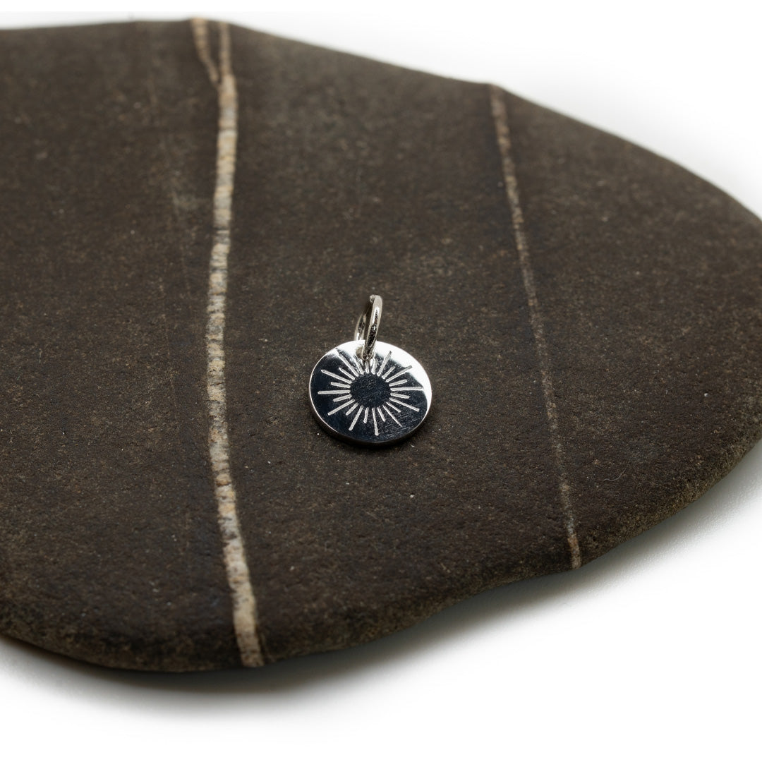 Makai Silver Sunburst Charm