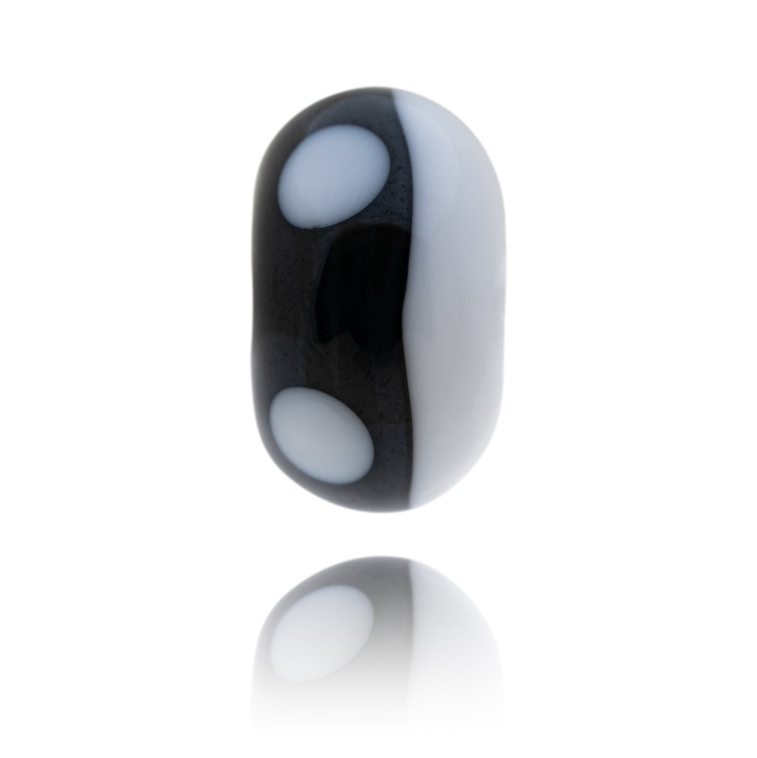 Black and white glass bead representing an Orca whale with proceeds of sales going to the Marine Connection charity.