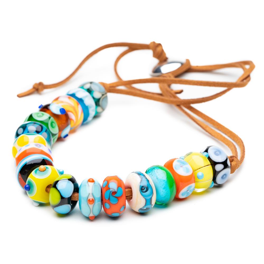 Bright colourful Murano glass beads representing travel and surf detonations from around the world.