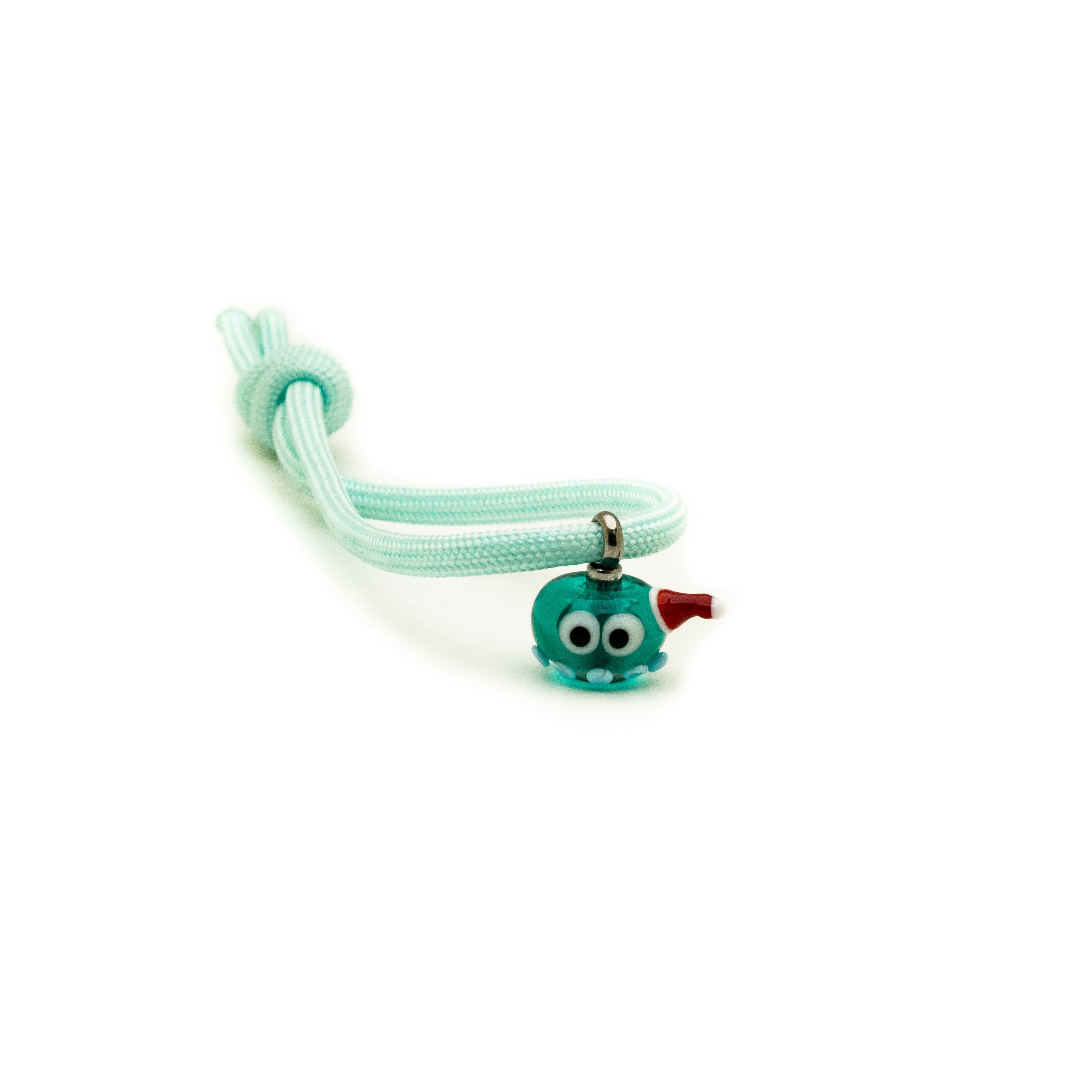 Teal glass charm bead shaped like an octopus wearing a Christmas hat on a piece of string.