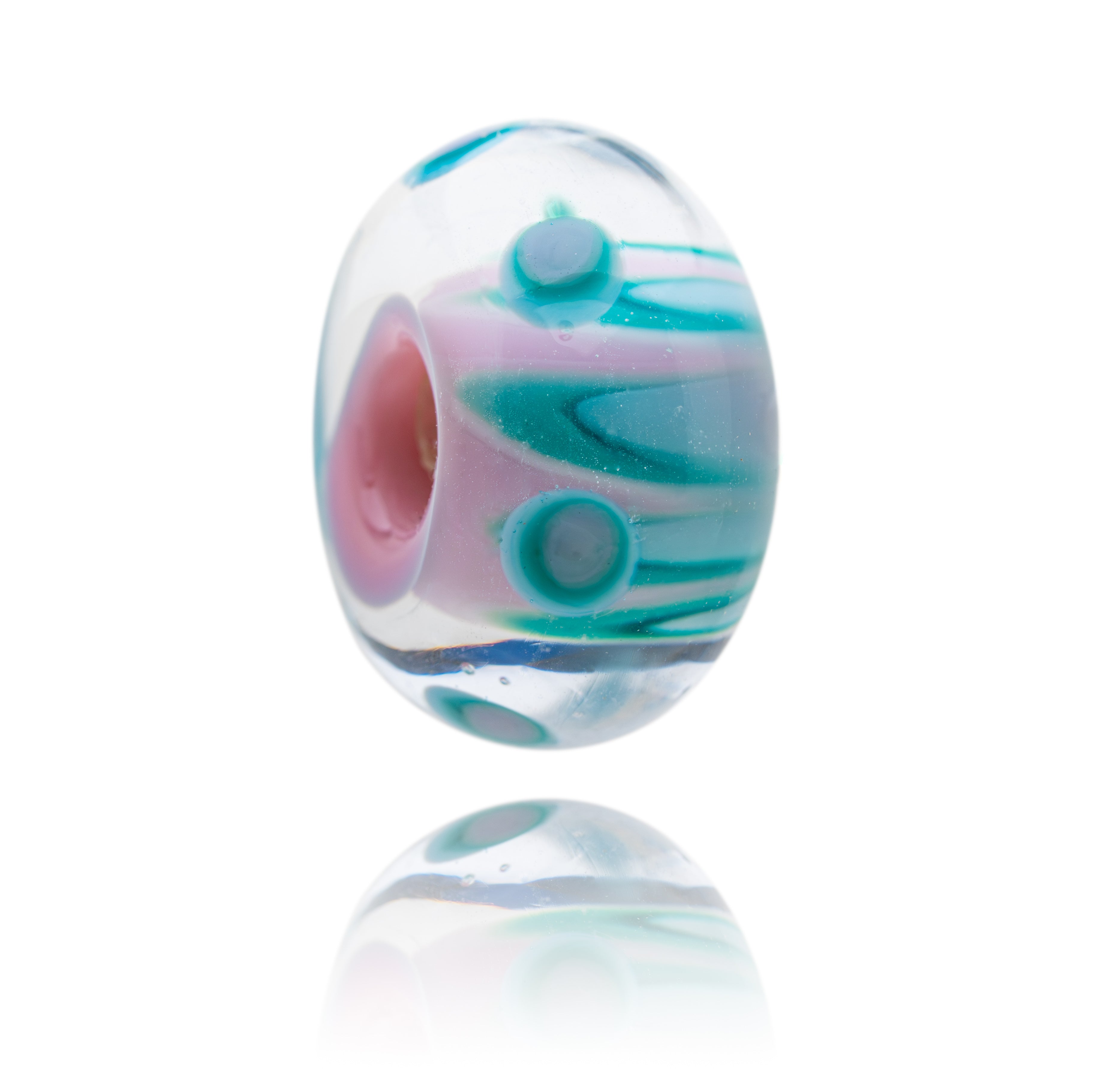 Glass bead with a pink core and layers of teal, white and turquoise petal decorations.