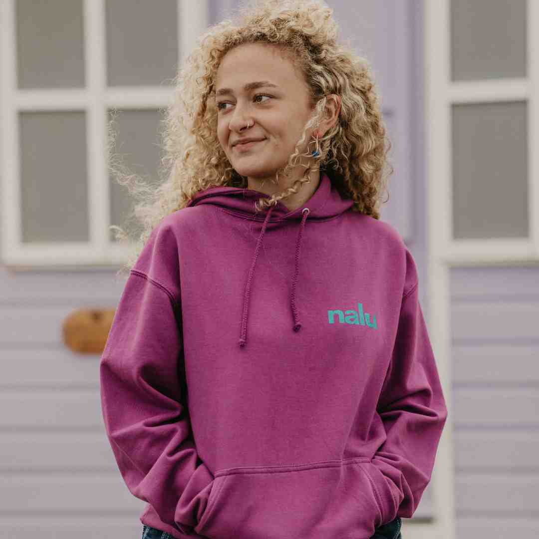 Woman wearing Nalu purple hoodie