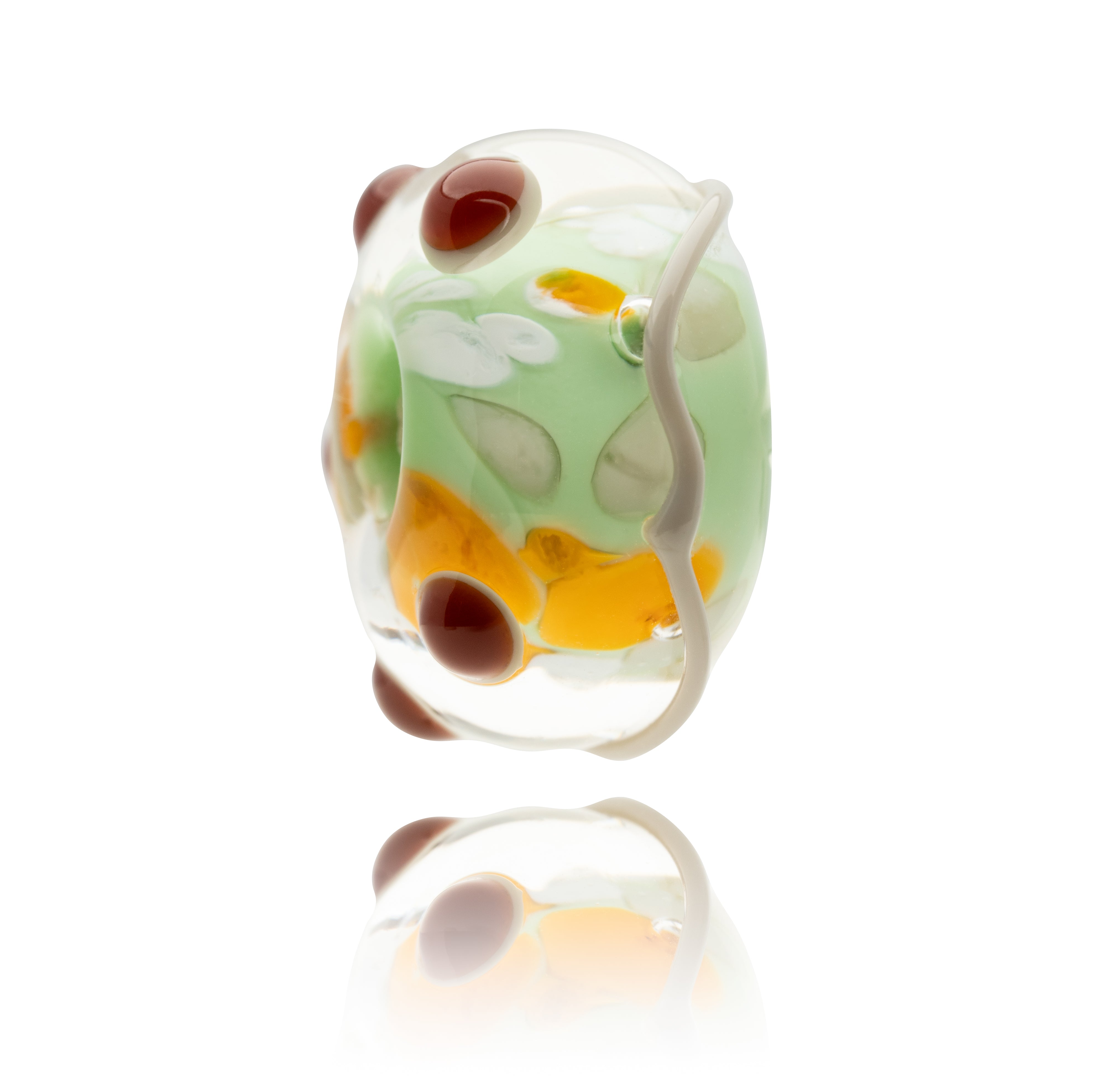 Glass bead with floral patterns on a white background