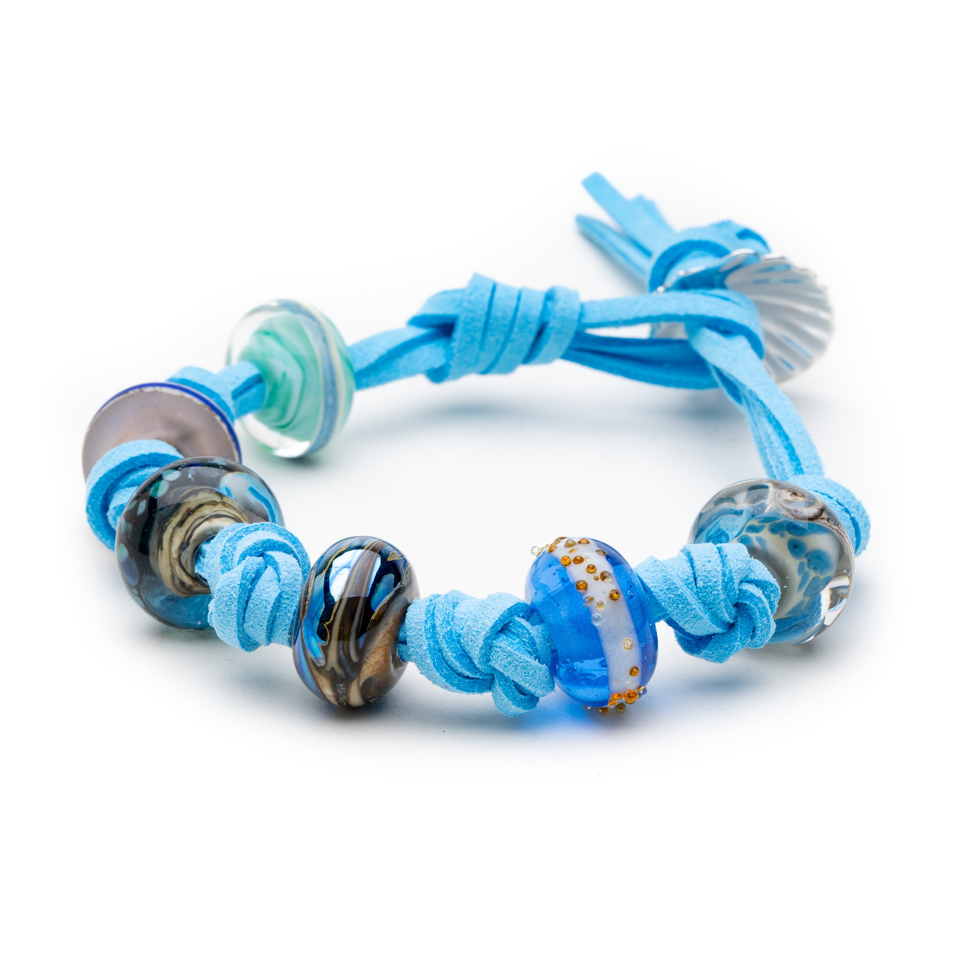 Simple knot bracelet with Murano glass charms inspired by Northumberland's beaches on sky blue cord.