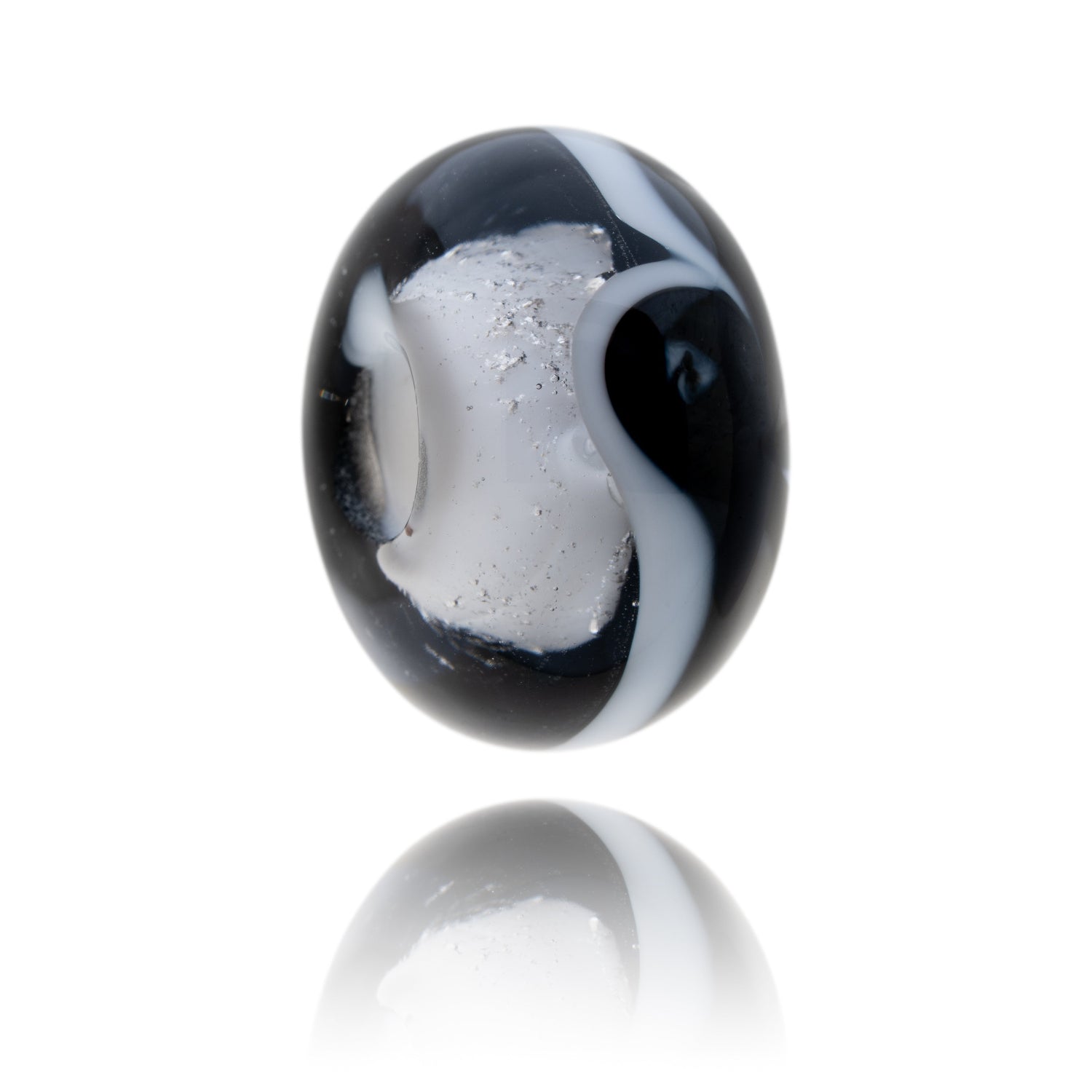 Black and clear glass bead representing the county of Northumberland.