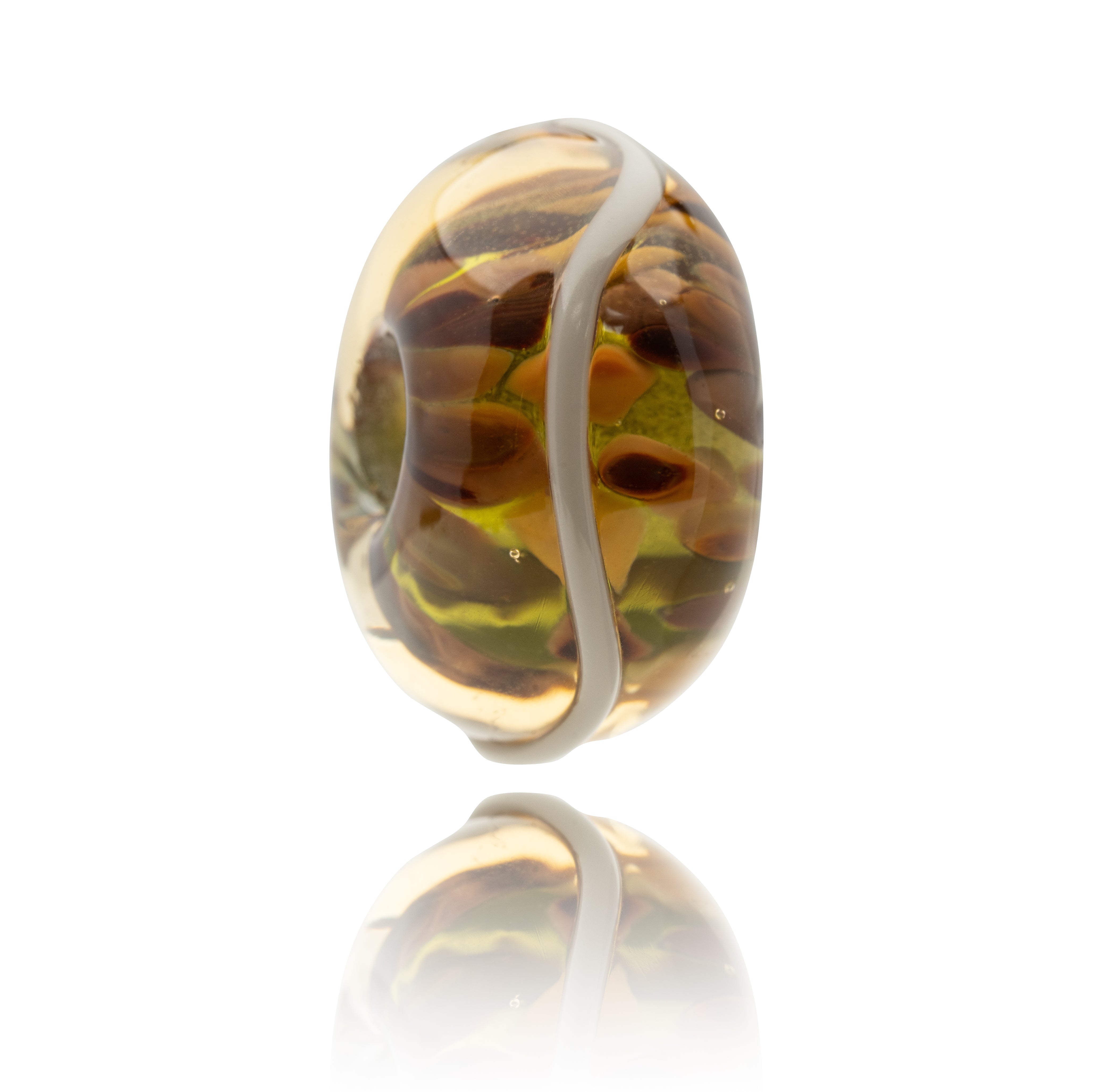 Glass bead with brown and yellow pattern on a white background