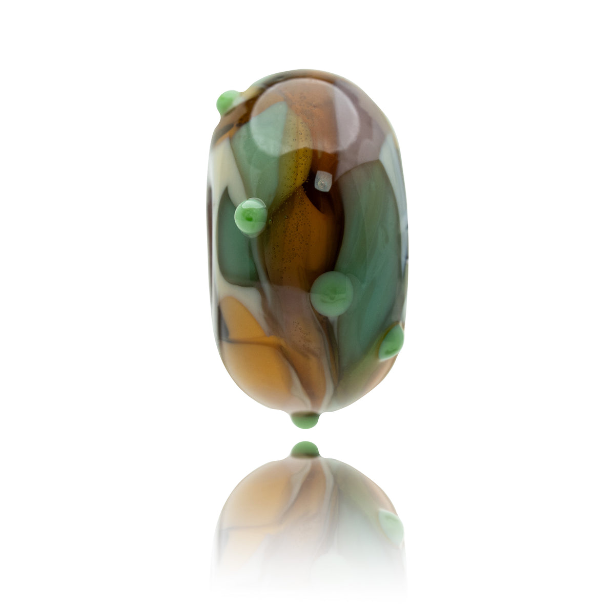 A single oval-shaped glass lampwork bead with a marbled pattern of brown, green, cream, and white, accented with small light green bubble details, shown on a reflective white background.