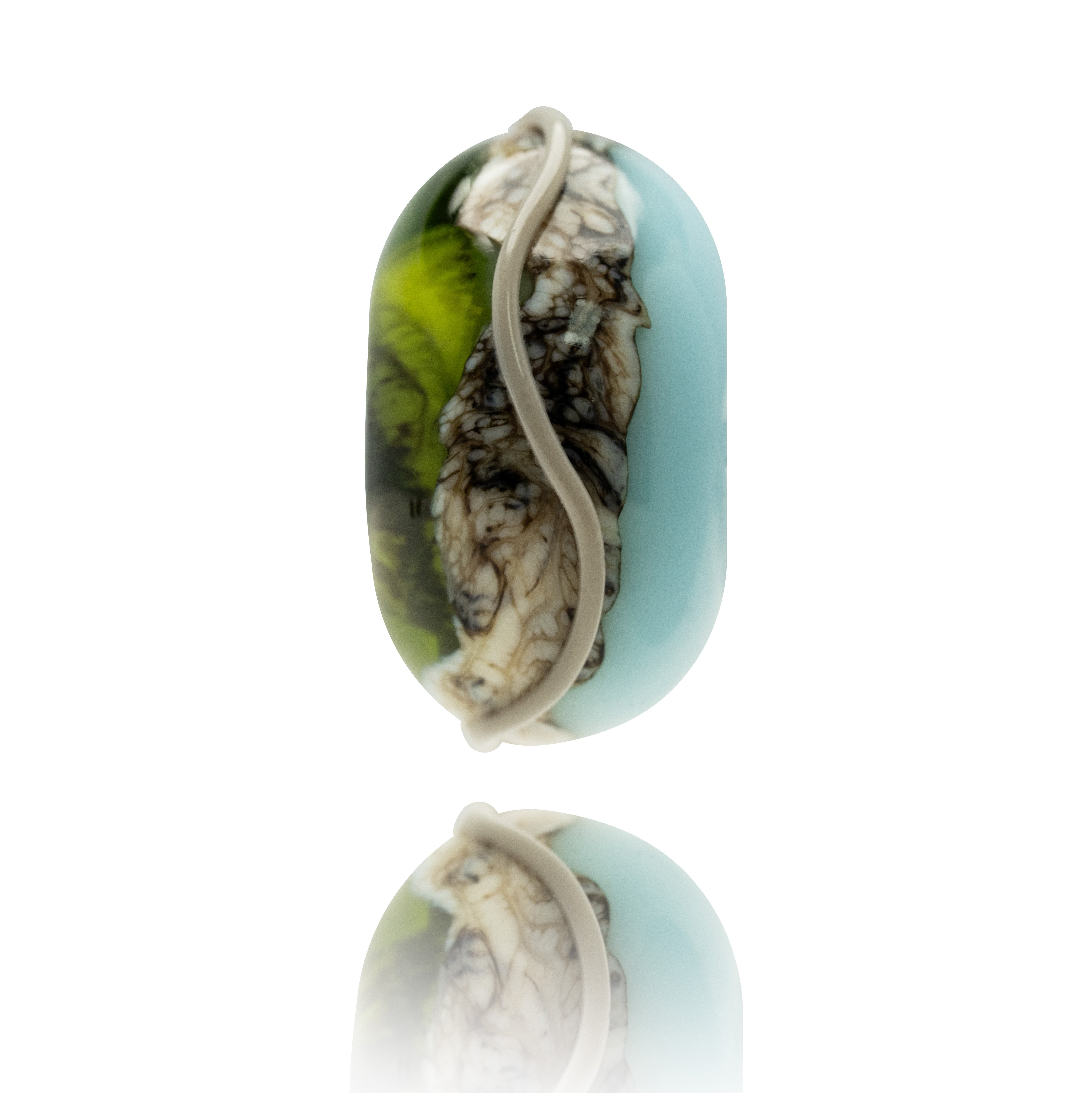 Blue, green and grey swirled glass bead on white background.