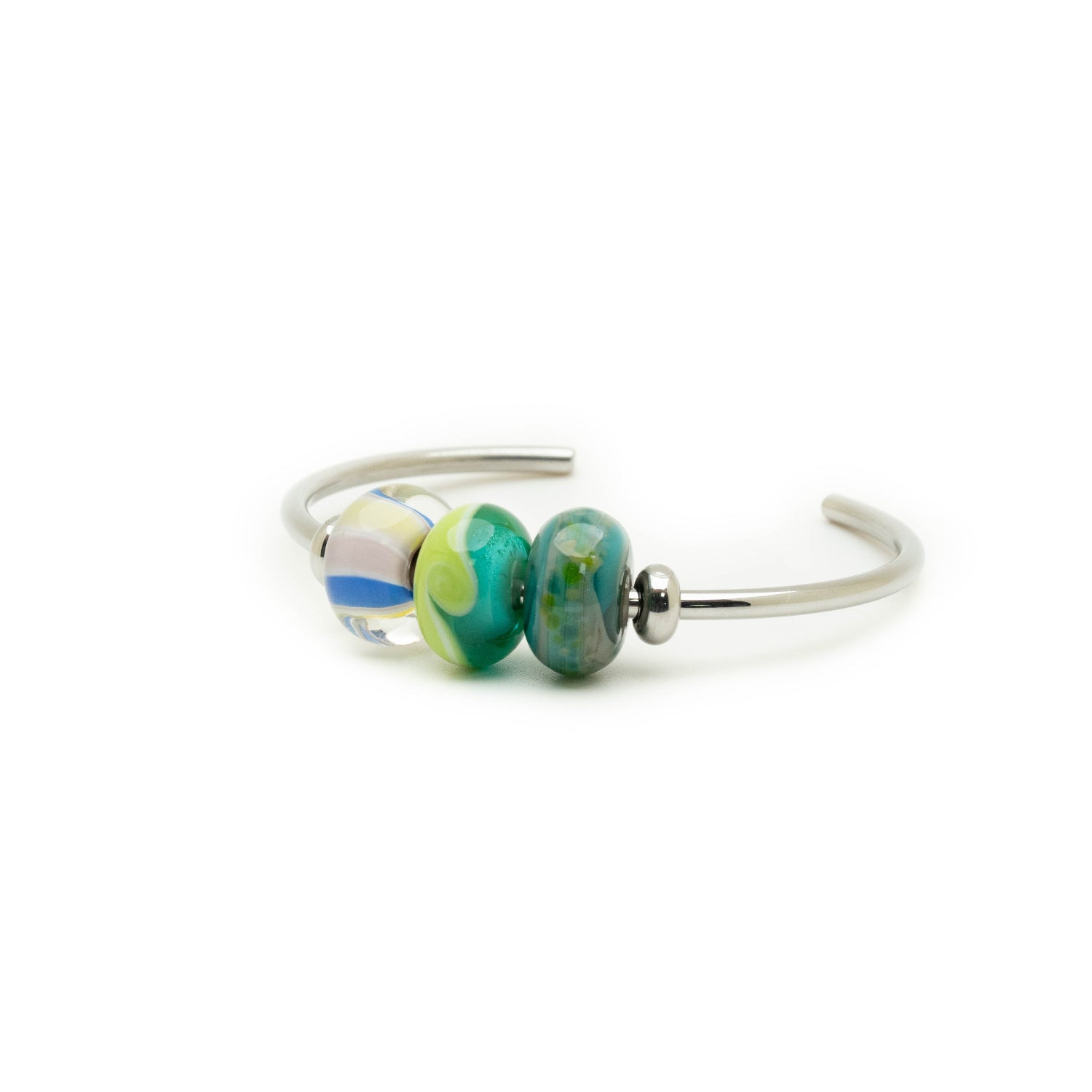 Pembrokeshire coast beads on green silver bangle.
