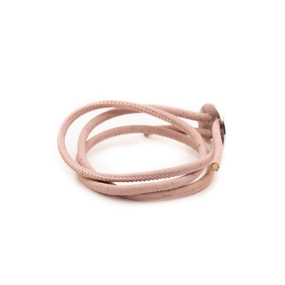 Pink braided cord on a white background