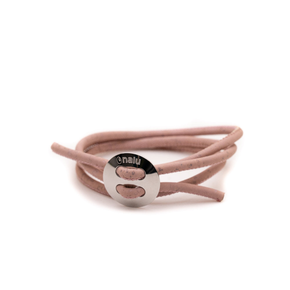 Pink bracelet with a silver toggle on a white background