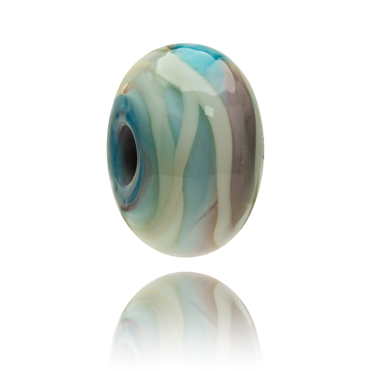 A single oval glass lampwork bead with a marbled swirl pattern of turquoise blue, cream, and taupe, shown floating above a clean white reflective surface.