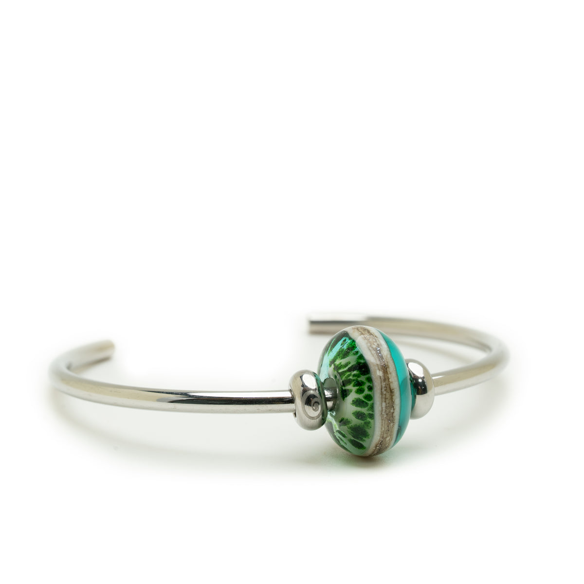 A silver-toned open cuff bangle bracelet featuring a central round glass bead with a green and white textured pattern and a turquoise accent.