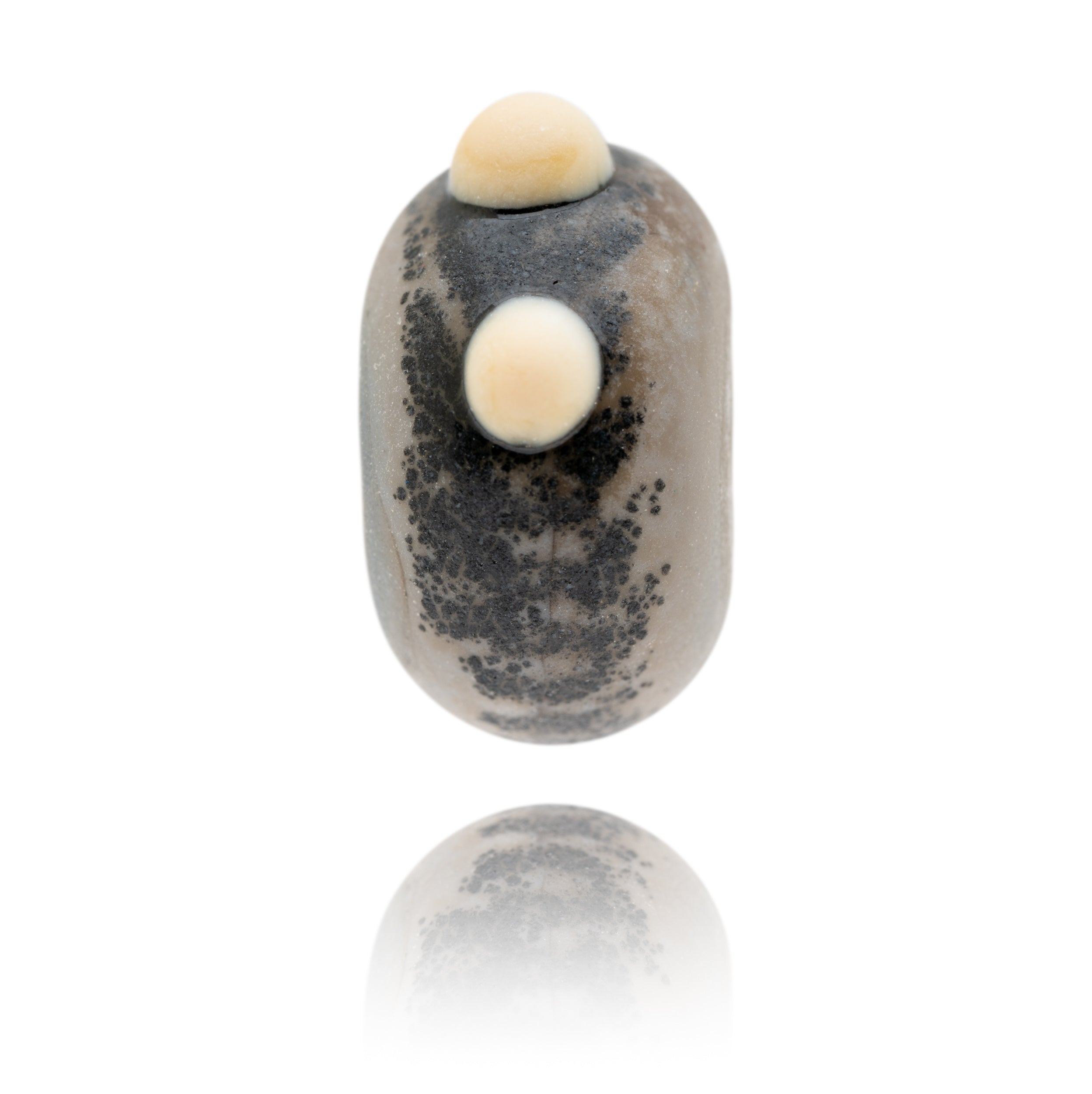 Grey glass bead representing a rhino being sold to raise funds for the World Wildlife Foundation.