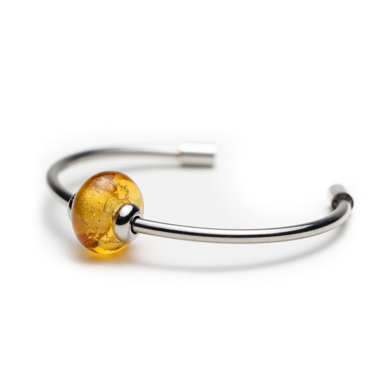 Steel bangle with amber glass bead.