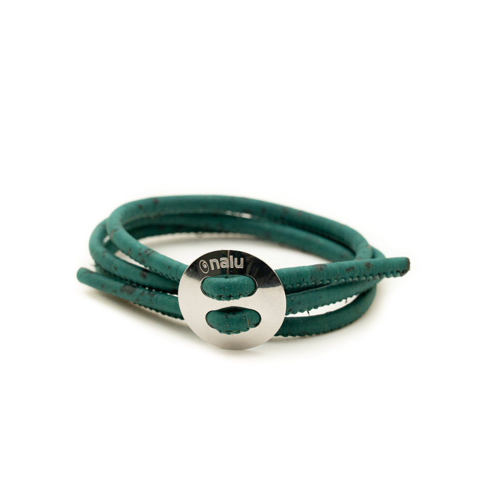 Teal leather bracelet with a silver circular clasp on a white background