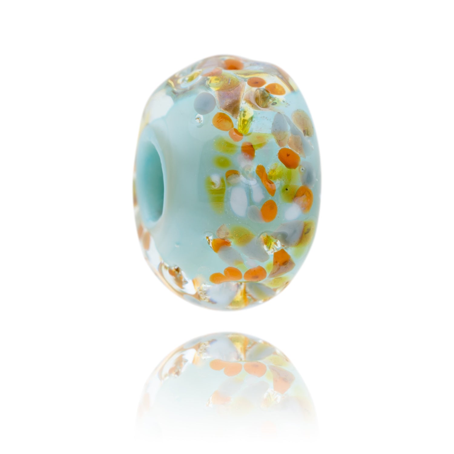 Pale blue glass bead with orange, green and white dots on the surface, designed to represent Seaford in Sussex.