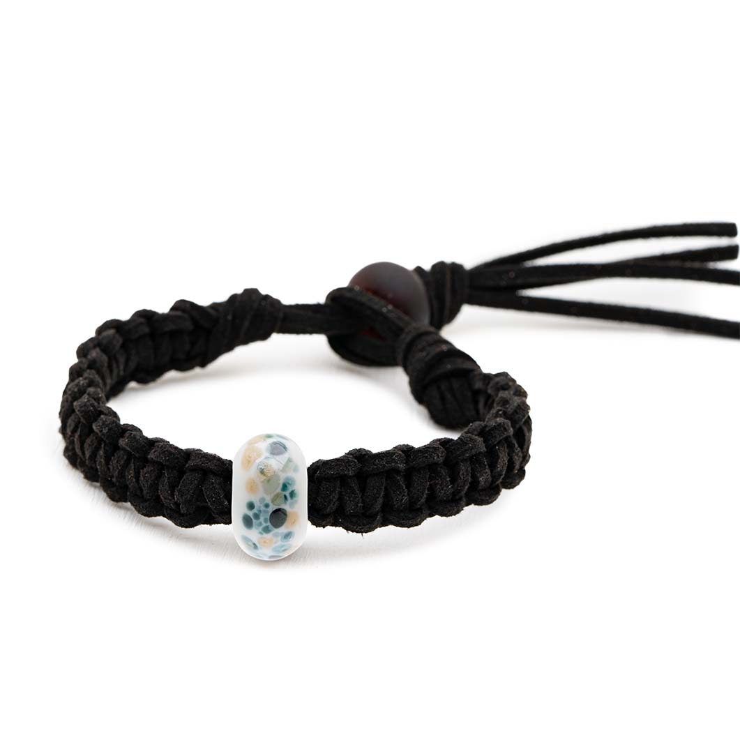 Grey glass bead bracelet with black and brown spotted patterns on the surface representing  a seal, being sold to support the Sea Life Charity.