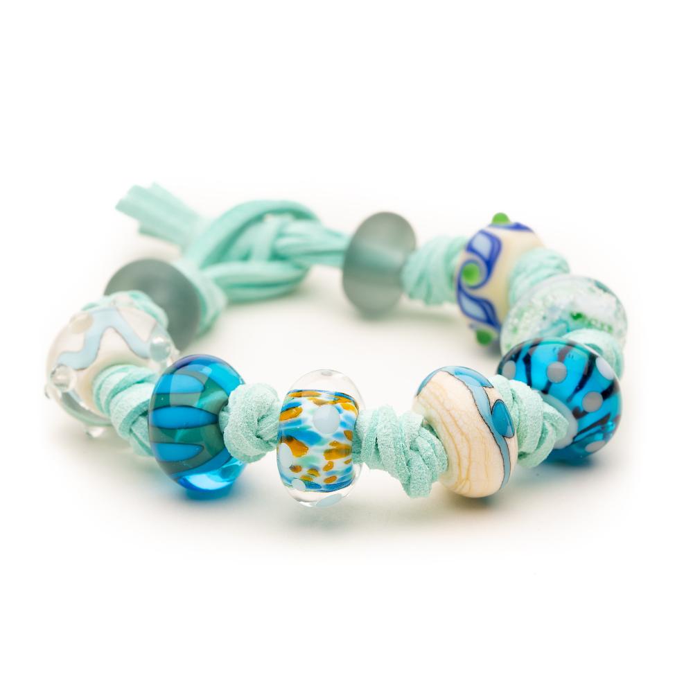 Mint cord bracelet with colourful murano glass beads representing beaches.