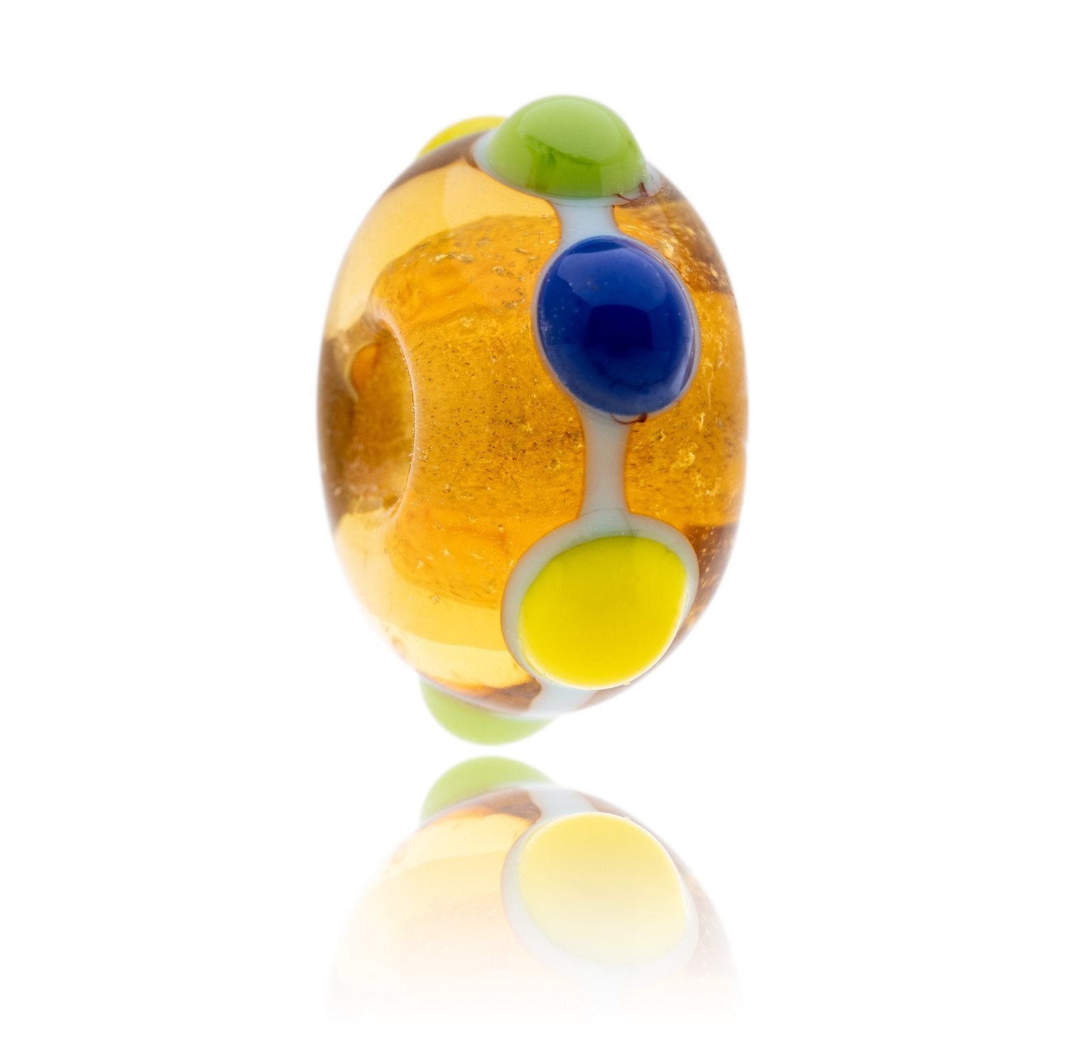 Gold glass bead with raised blue, yellow and green dots on the surface. Representing Skegness beach in Lincolnshire.