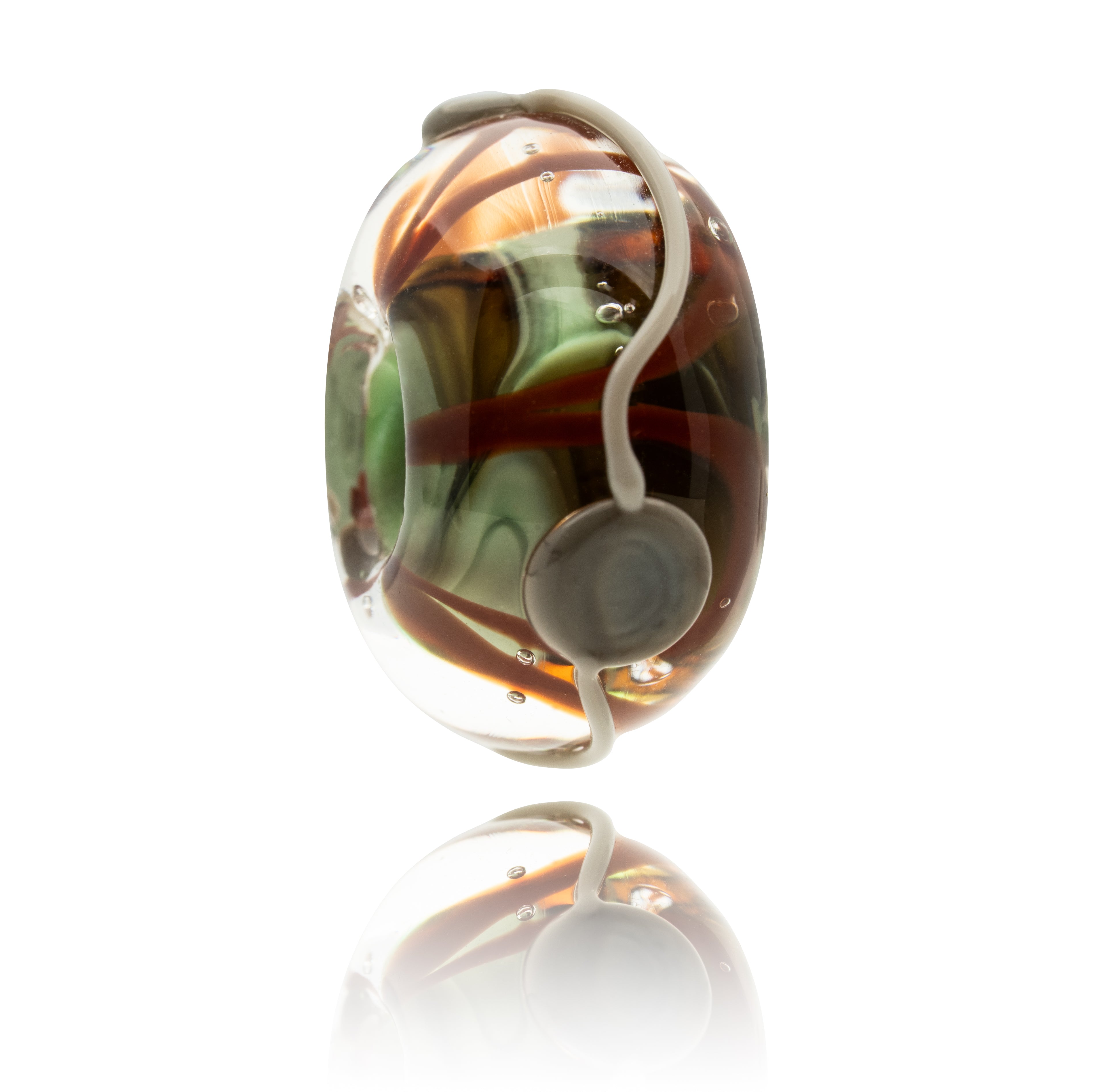 Colourful glass bead with a white pattern on surface on a white background.