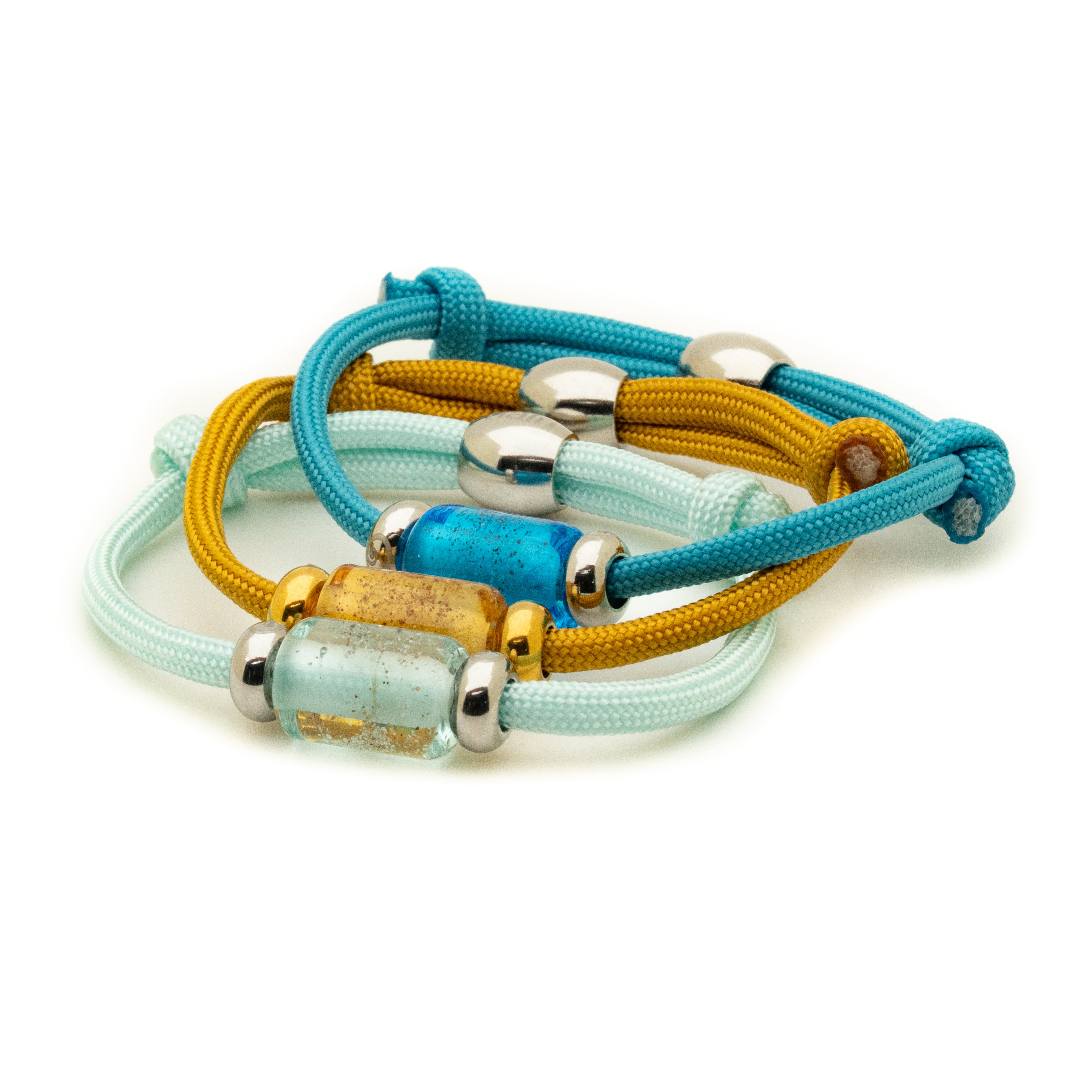 Set of colorful bracelets with metal beads on a white background