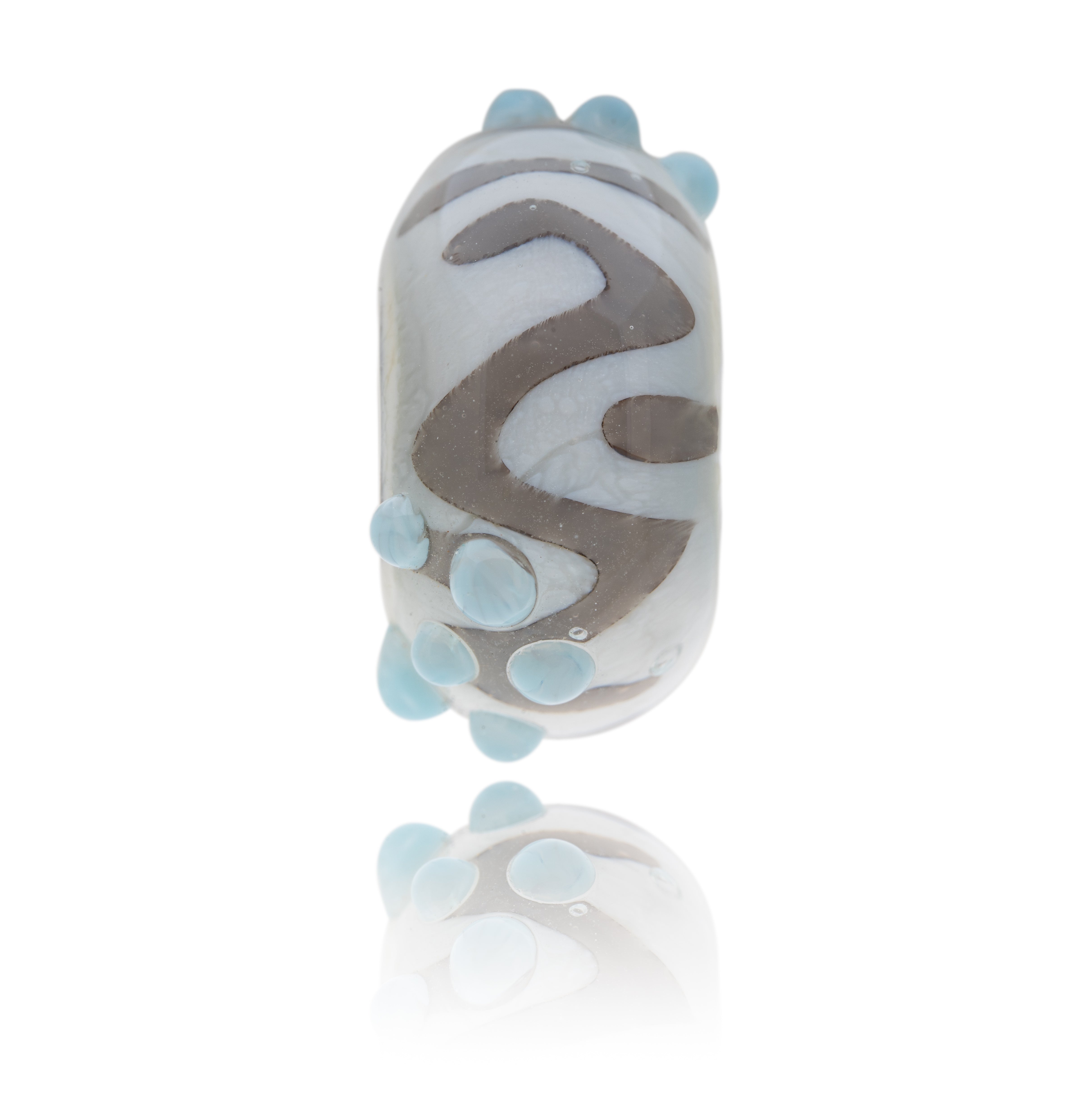 Grey, blue and white patterned bead representing St Agnes in Cornwall.