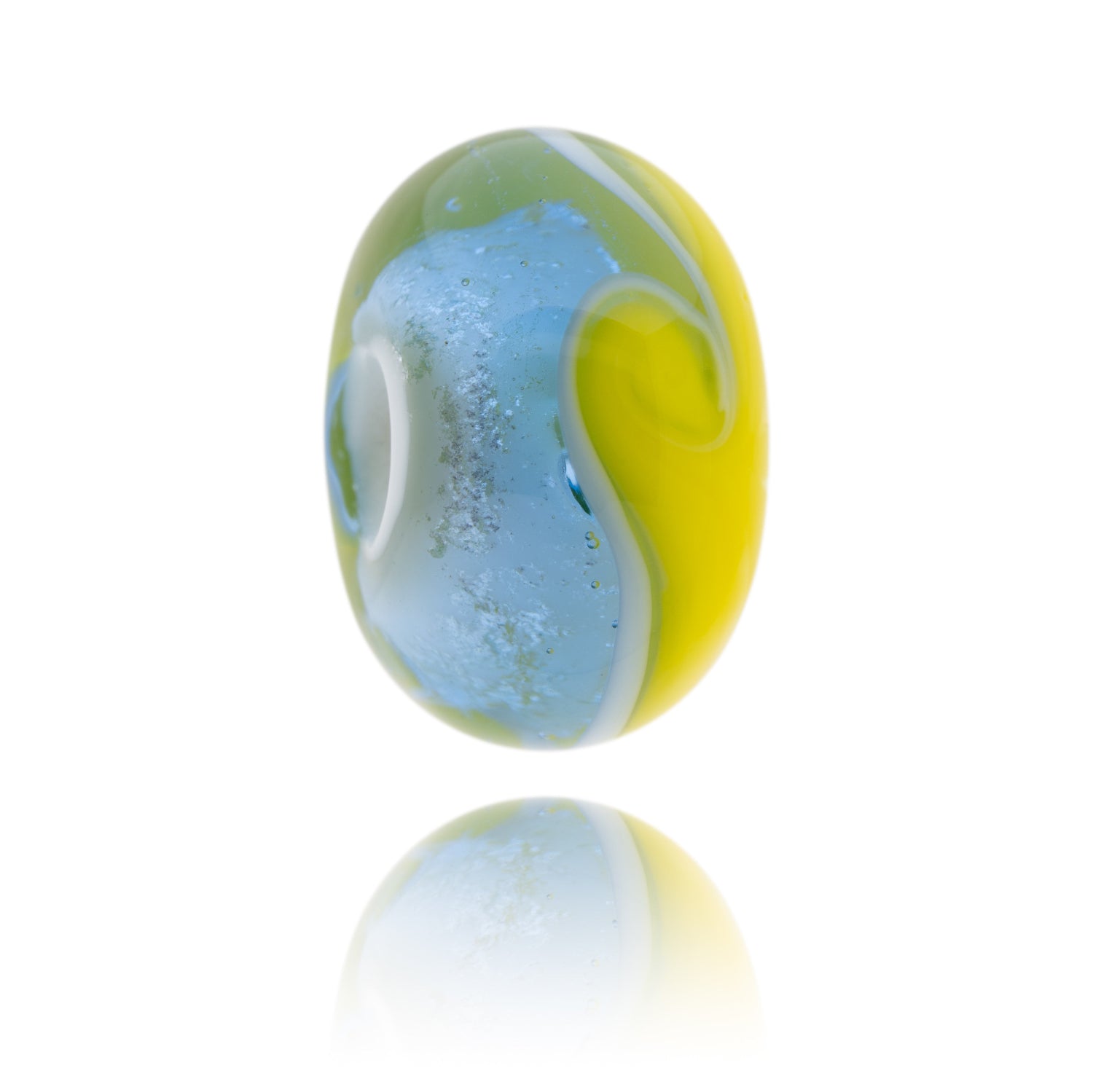 A lavender and yellow glass bead made to represent the castle areas of Suffolk County.