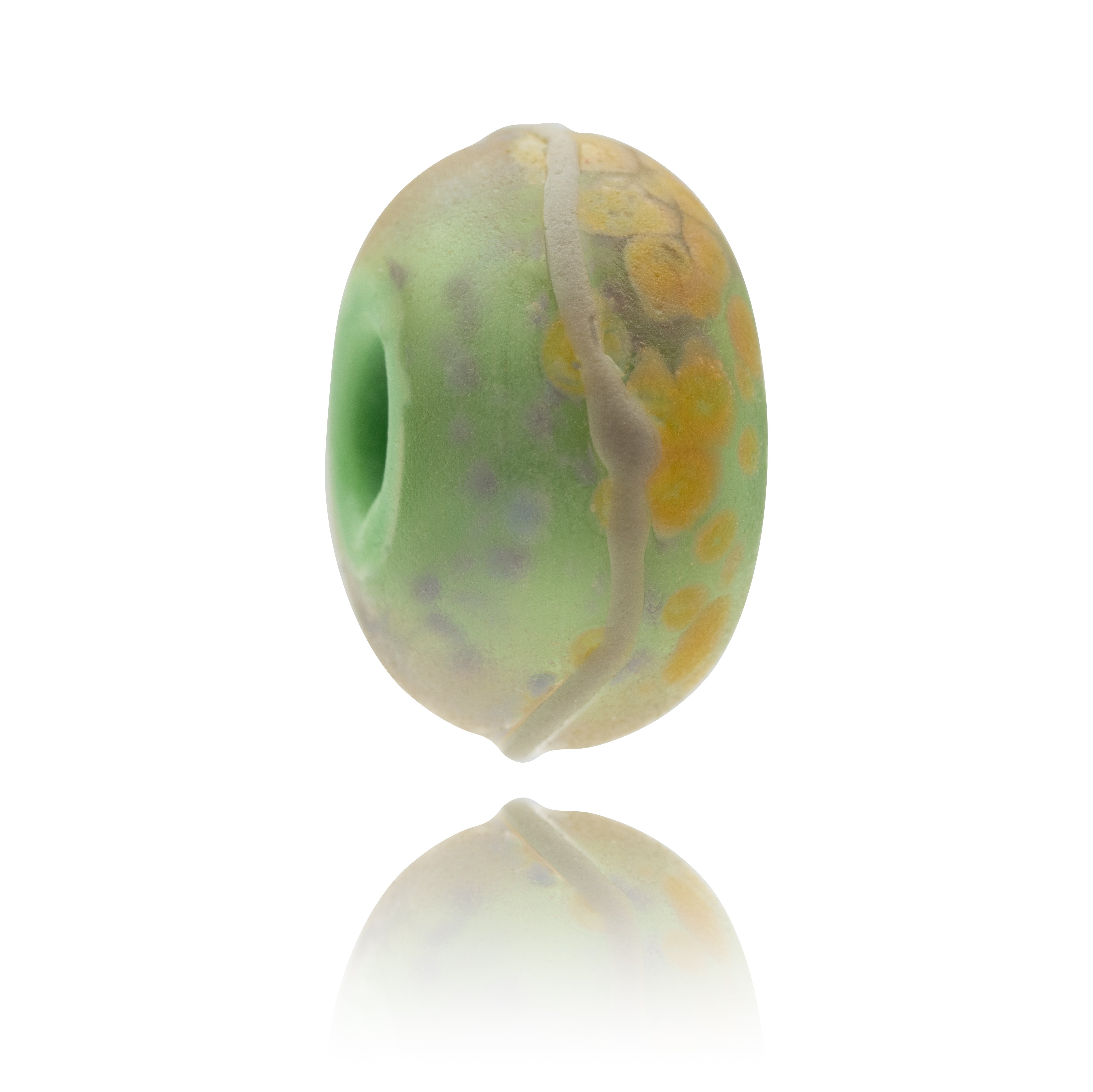 Frosted glass bead in shades of green, beige and grey.