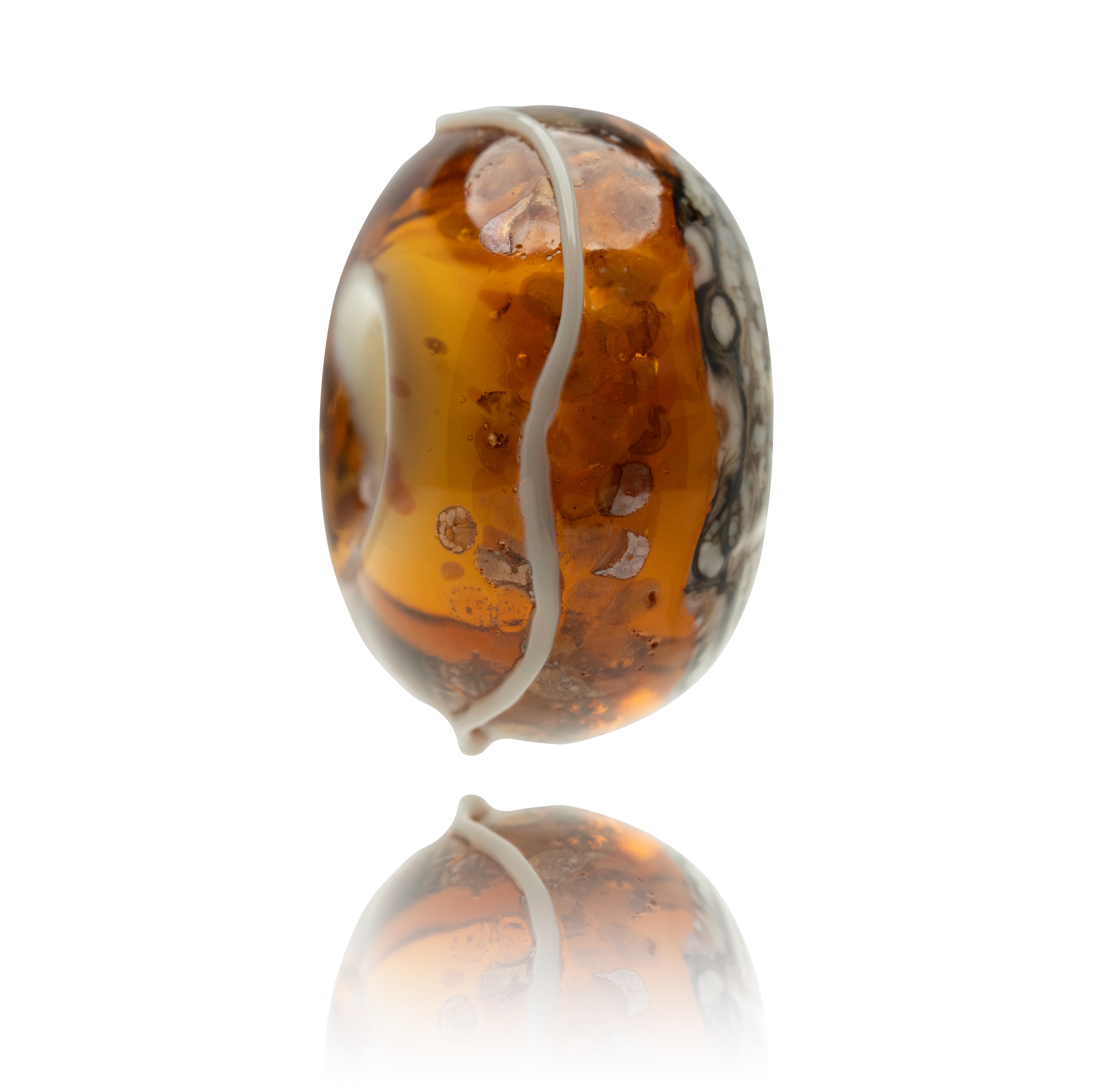 Marbled brown and white glass bead on a white background