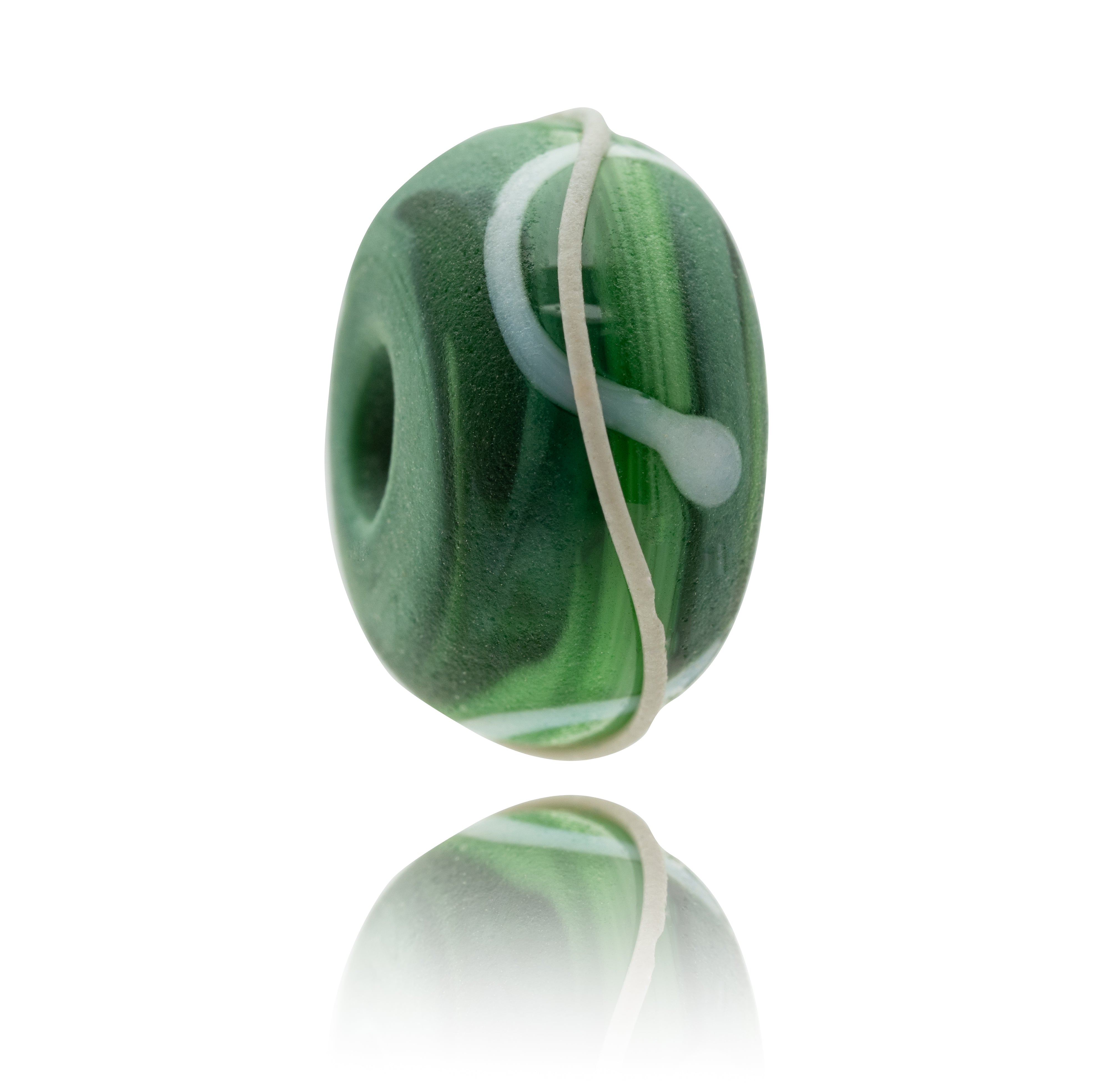 Swirling green glass bead decorated with white stripes and grey path.
