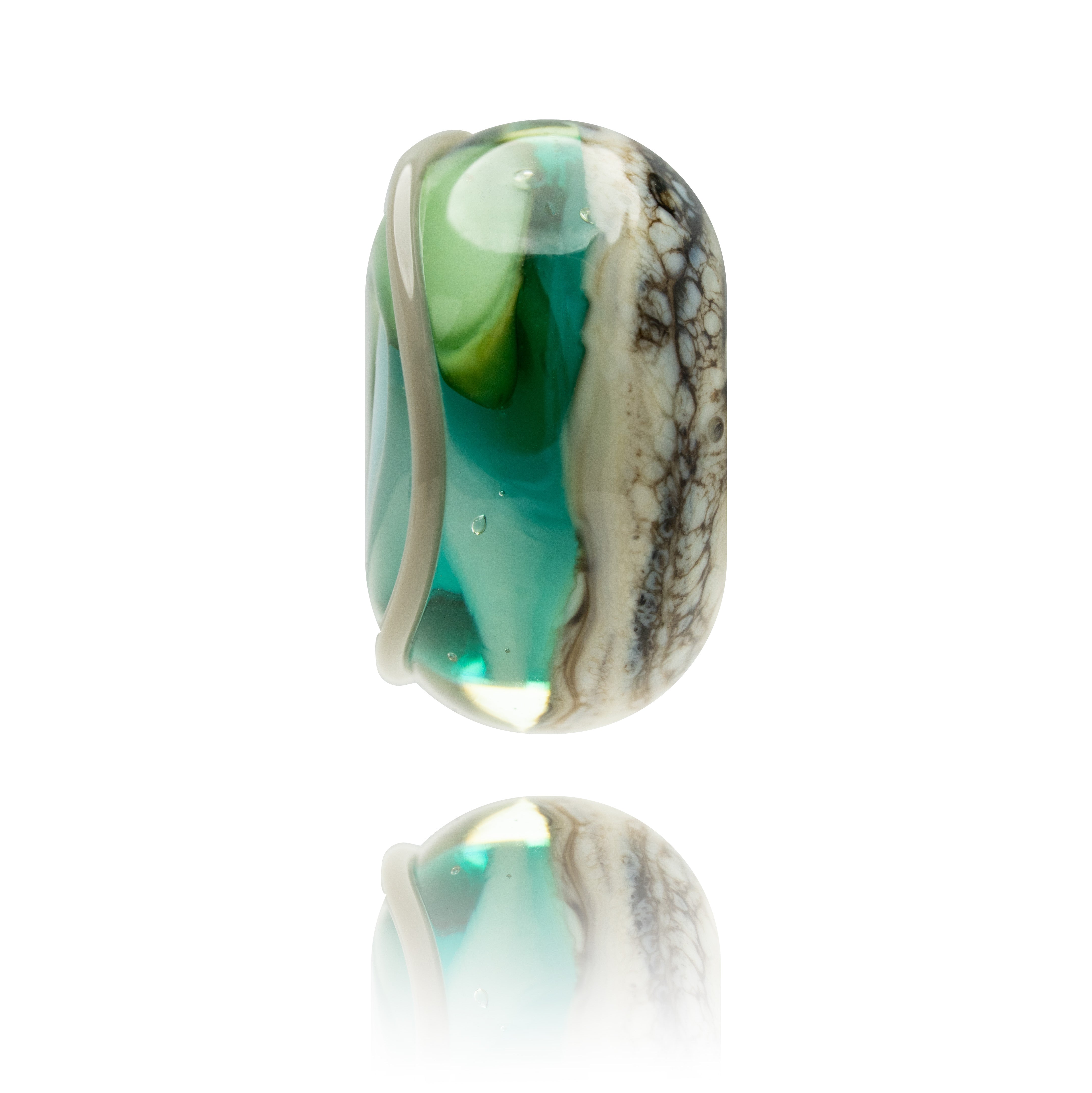 Green and blue swirling glass bead with melted grey patterns on surface.