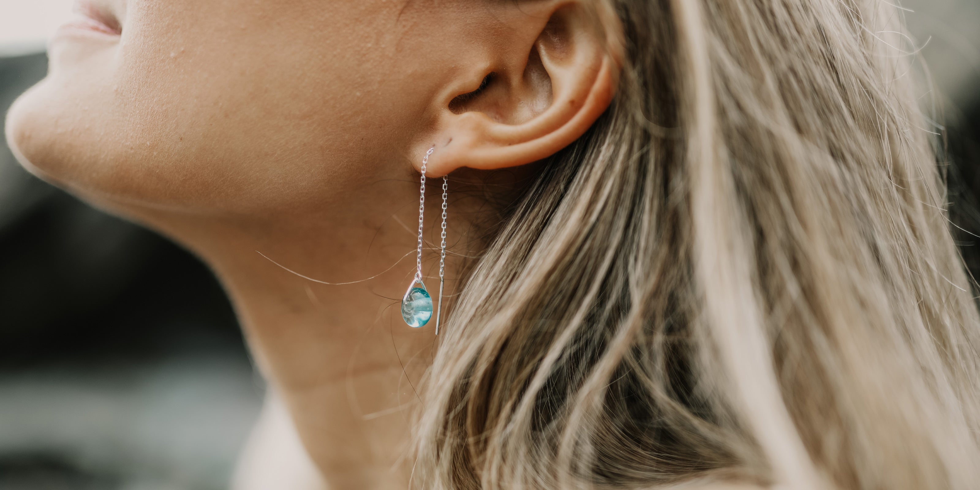 Mint glass beads on silver thread through earrings.