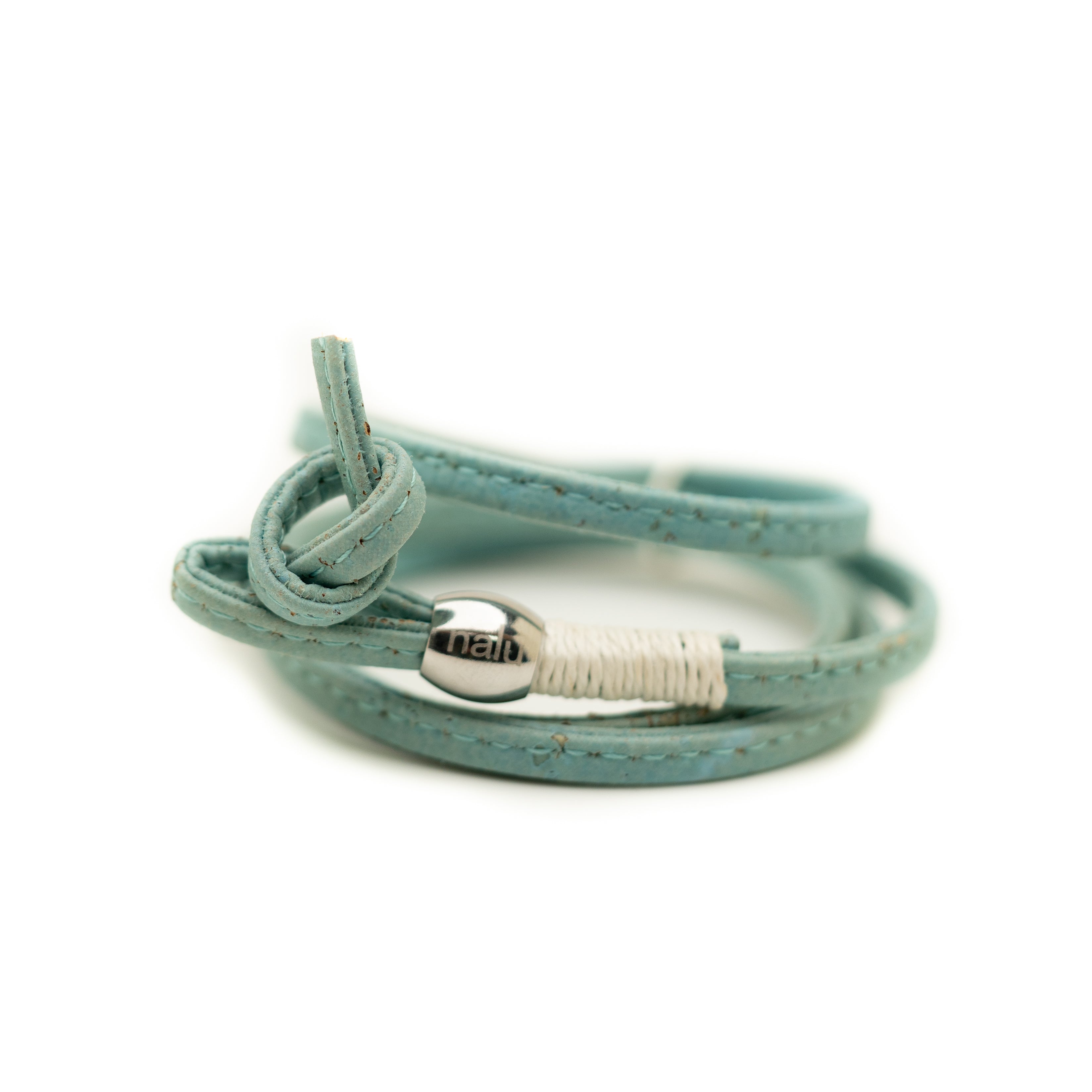 Turquoise cork bracelet with a silver clasp on a white background
