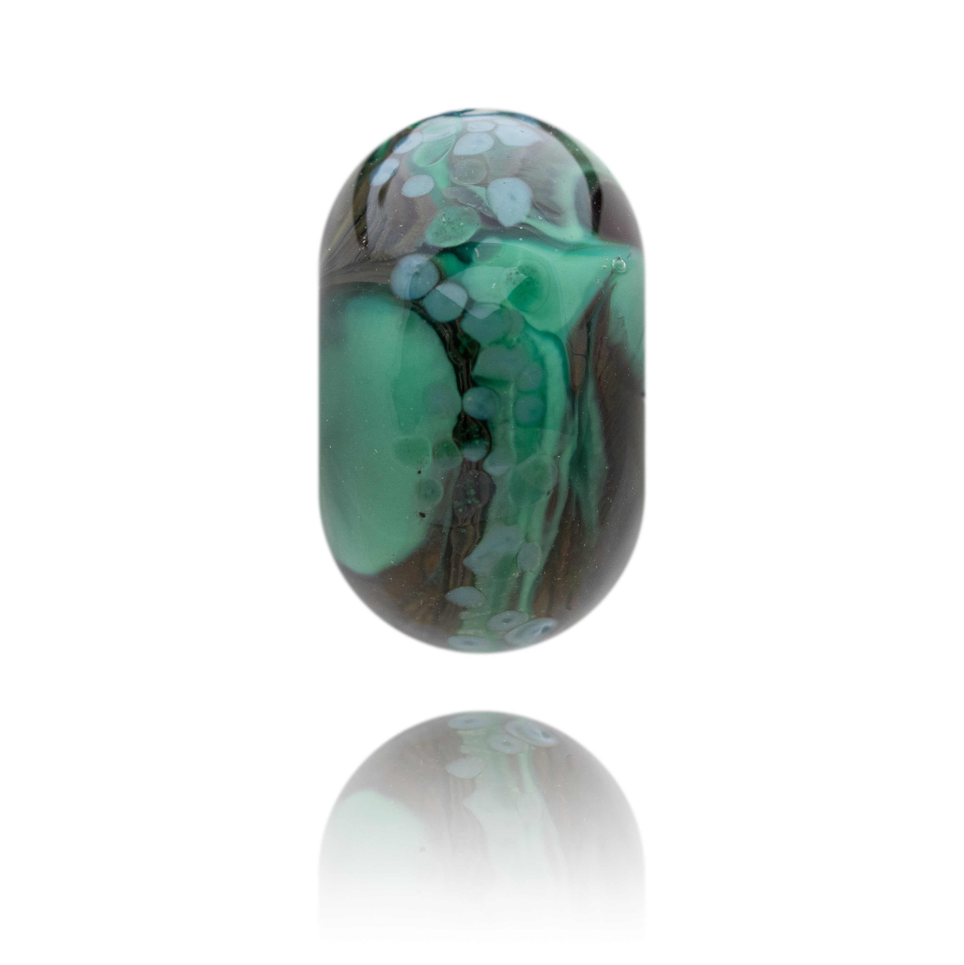 Decorative glass bead with green and brown patterns on a white background