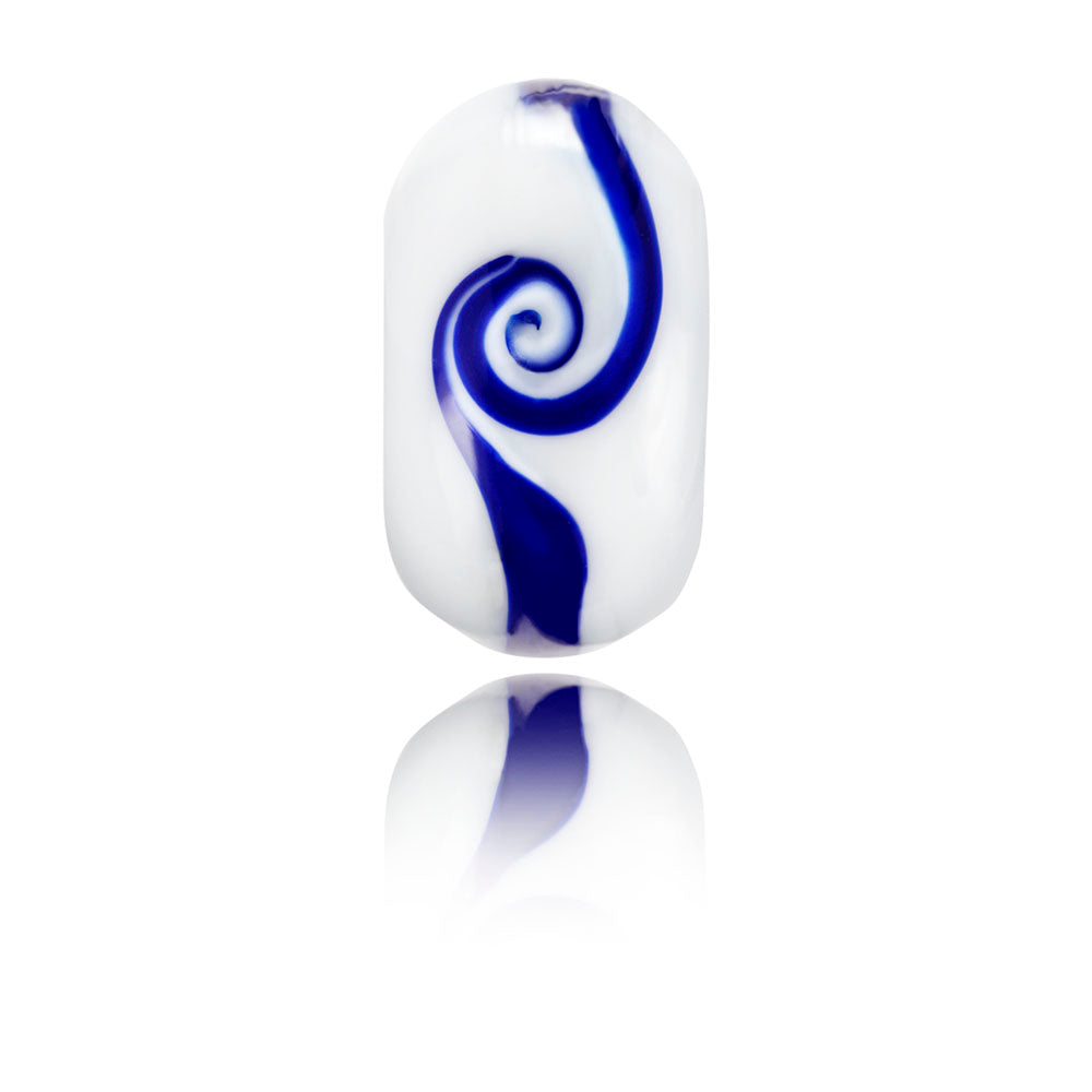 White glass bead with a dark blue swirl pattern, sold in support of the Wave Project.