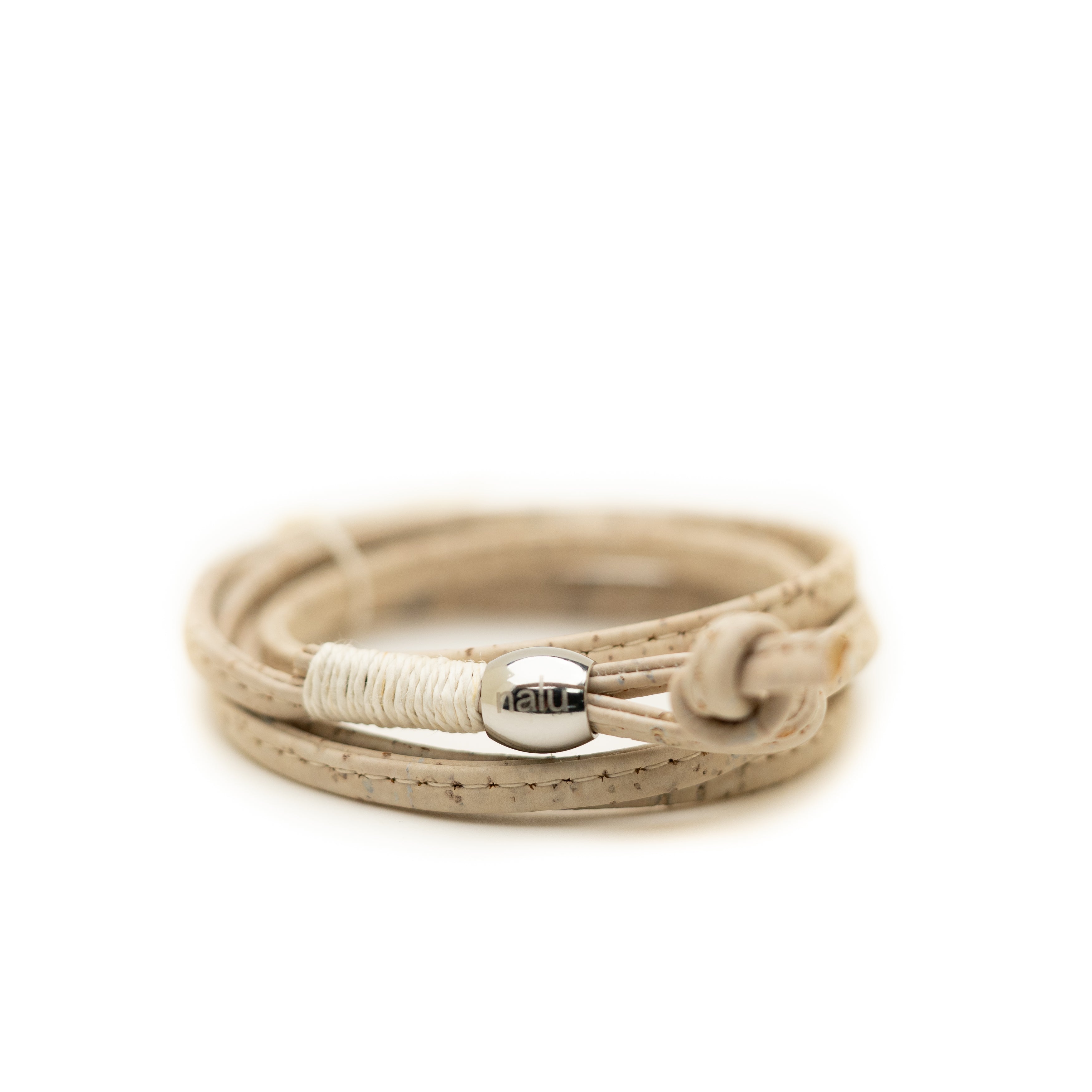 Beige cork bracelet with silver clasp on a white background
