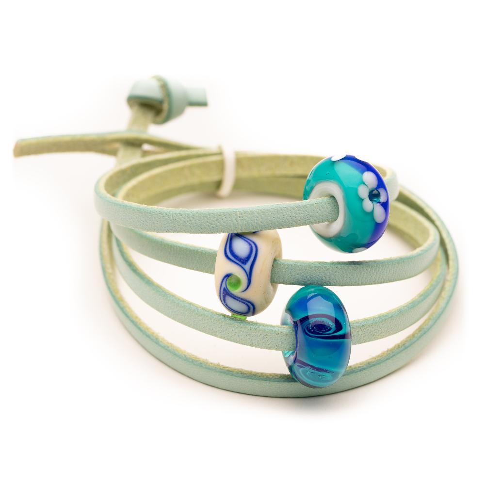 Aqua leather wrap with blue, green, white Murano glass beads.