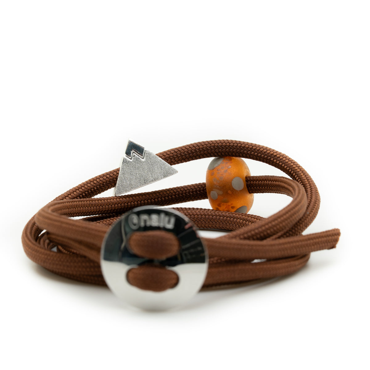 A brown elastic wrap bracelet featuring a silver mountain-shaped charm, a round silver clasp engraved with 'nailu', and an orange marbled bead accent, shown on a white background.