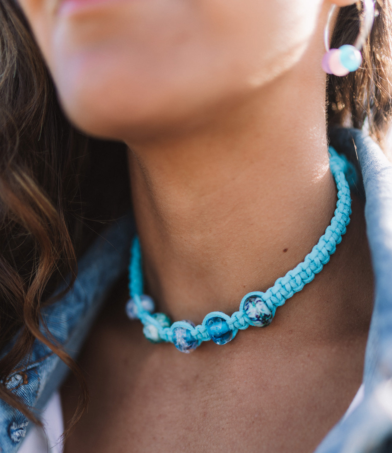 Cornish beads in shades of blue on turquoise macrame chocker necklace.