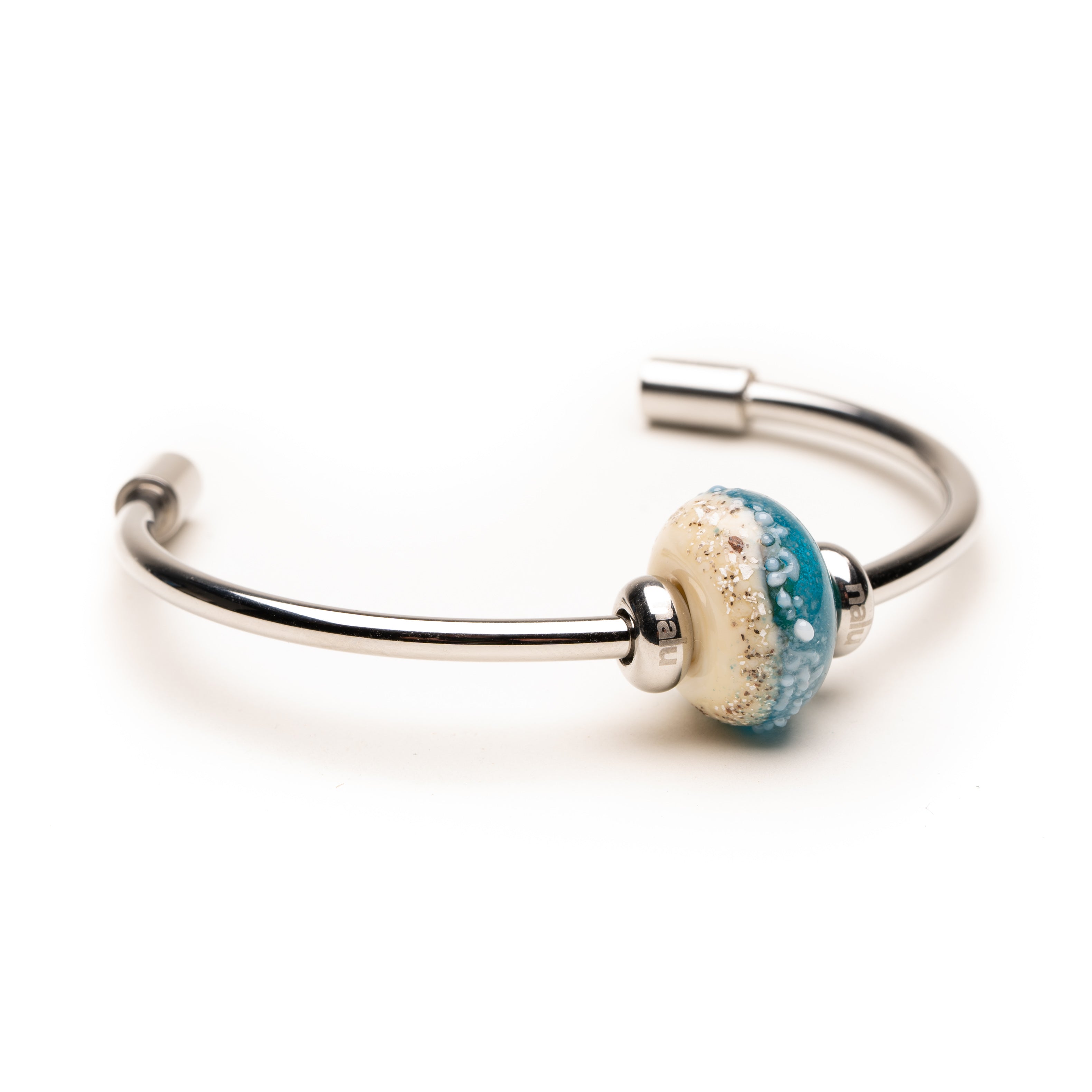 Fistral shoreline bead on silver bangle.