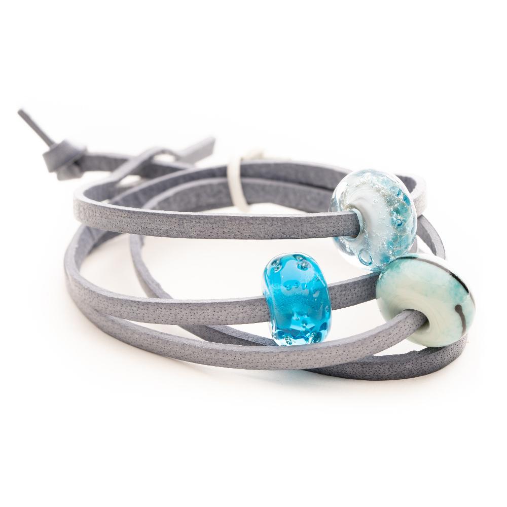 Grey leather wrap bracelet with blue glass beads.