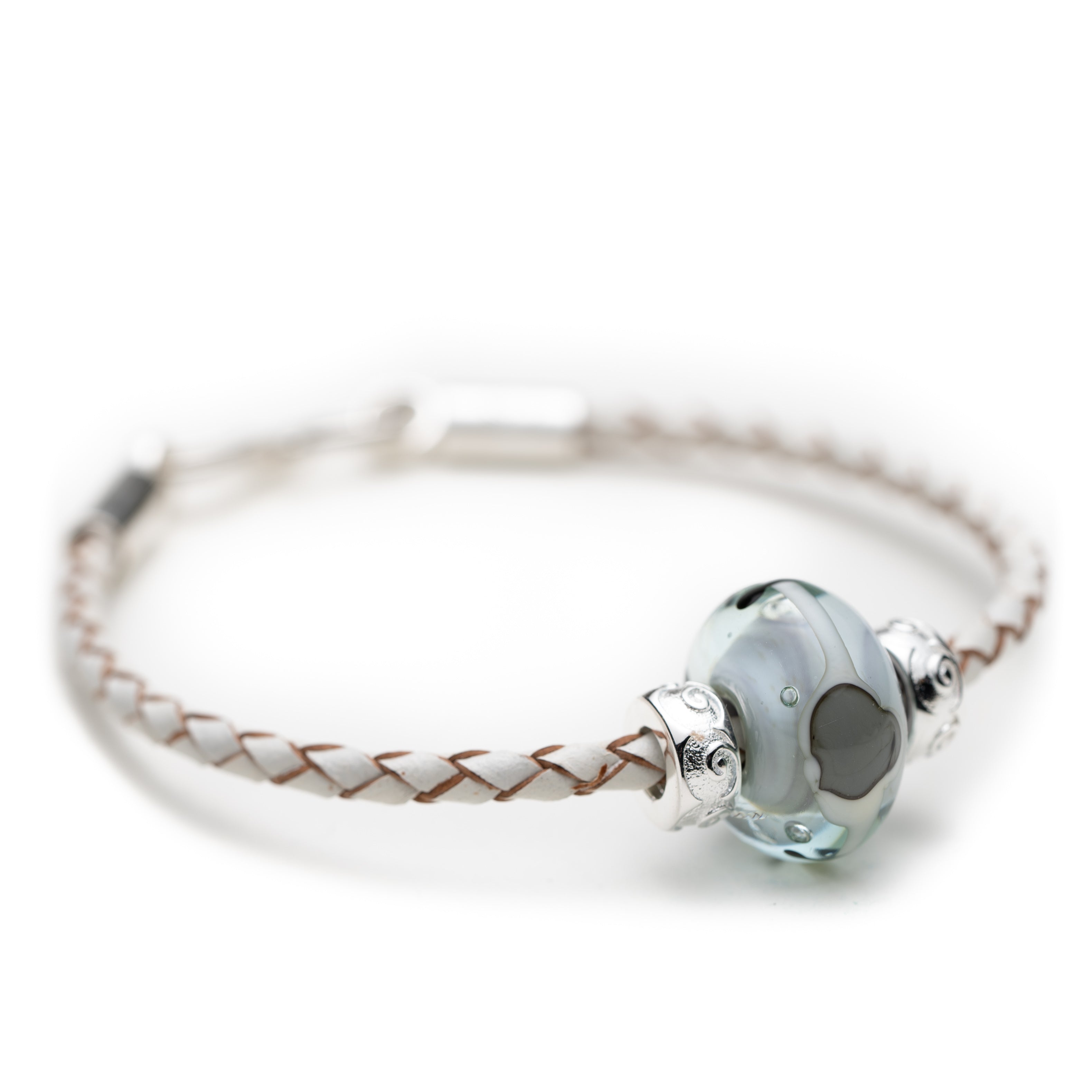 White plaited leather bracelet with grey patterned glass bead.