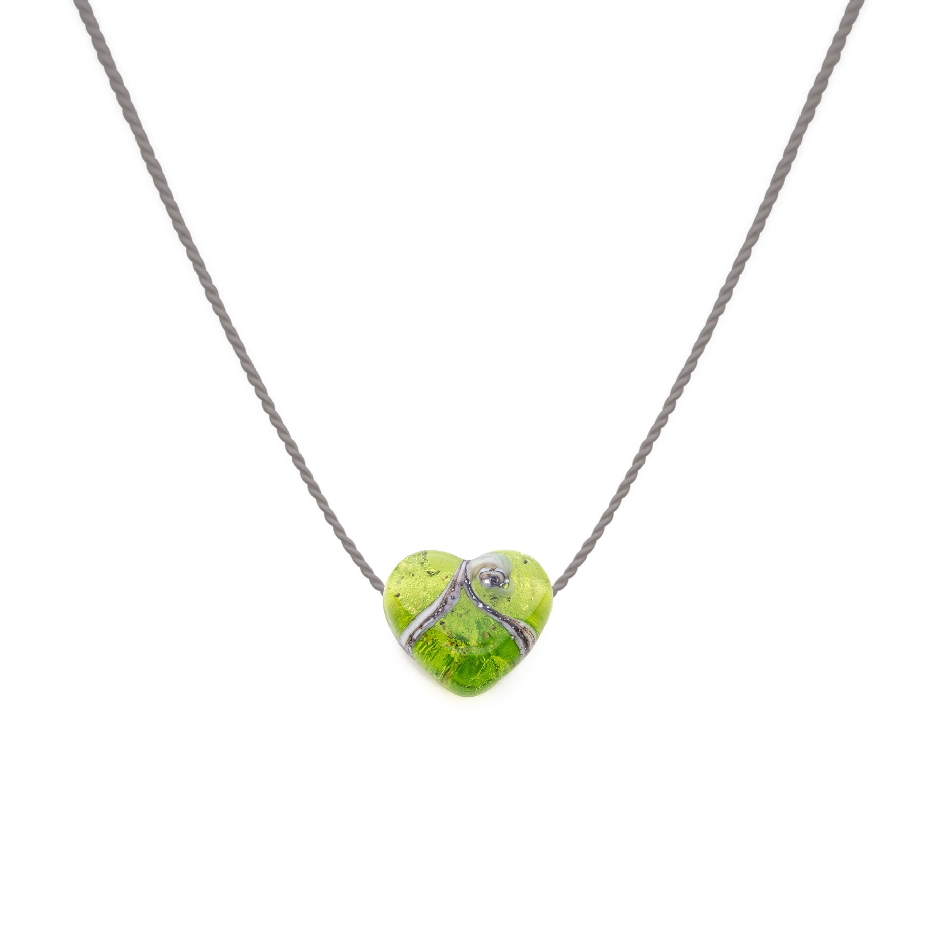 Apple green coloured glass heart shaped bead with grains of sand from your chosen beach in the glass, strung on a silk necklace.