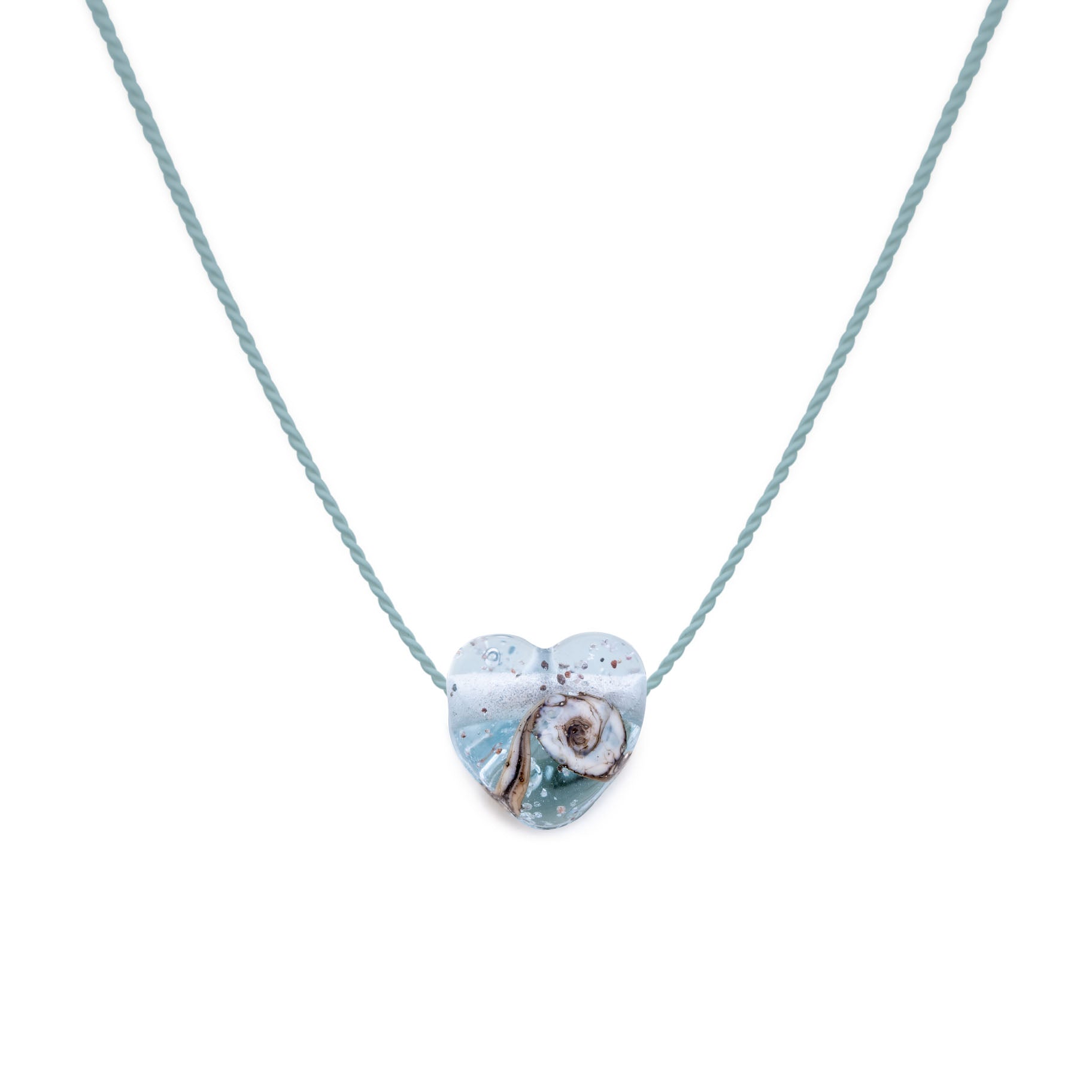 Mint coloured glass heart shaped bead with grains of sand from your chosen beach in the glass, strung on a silk necklace.