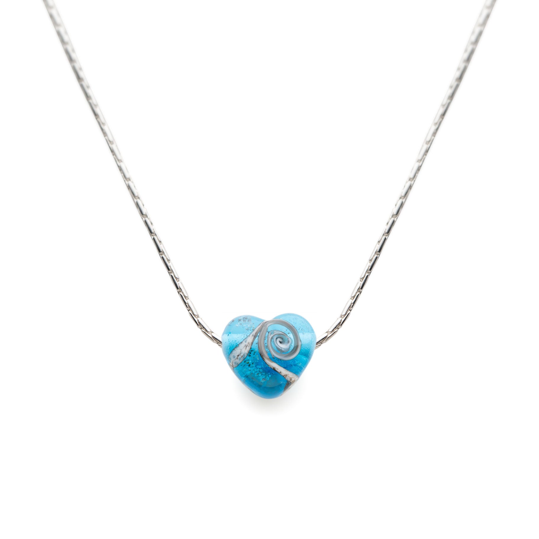 A heart-shaped turquoise glass bead with a silver wave design, attached to a fine sterling silver chain.