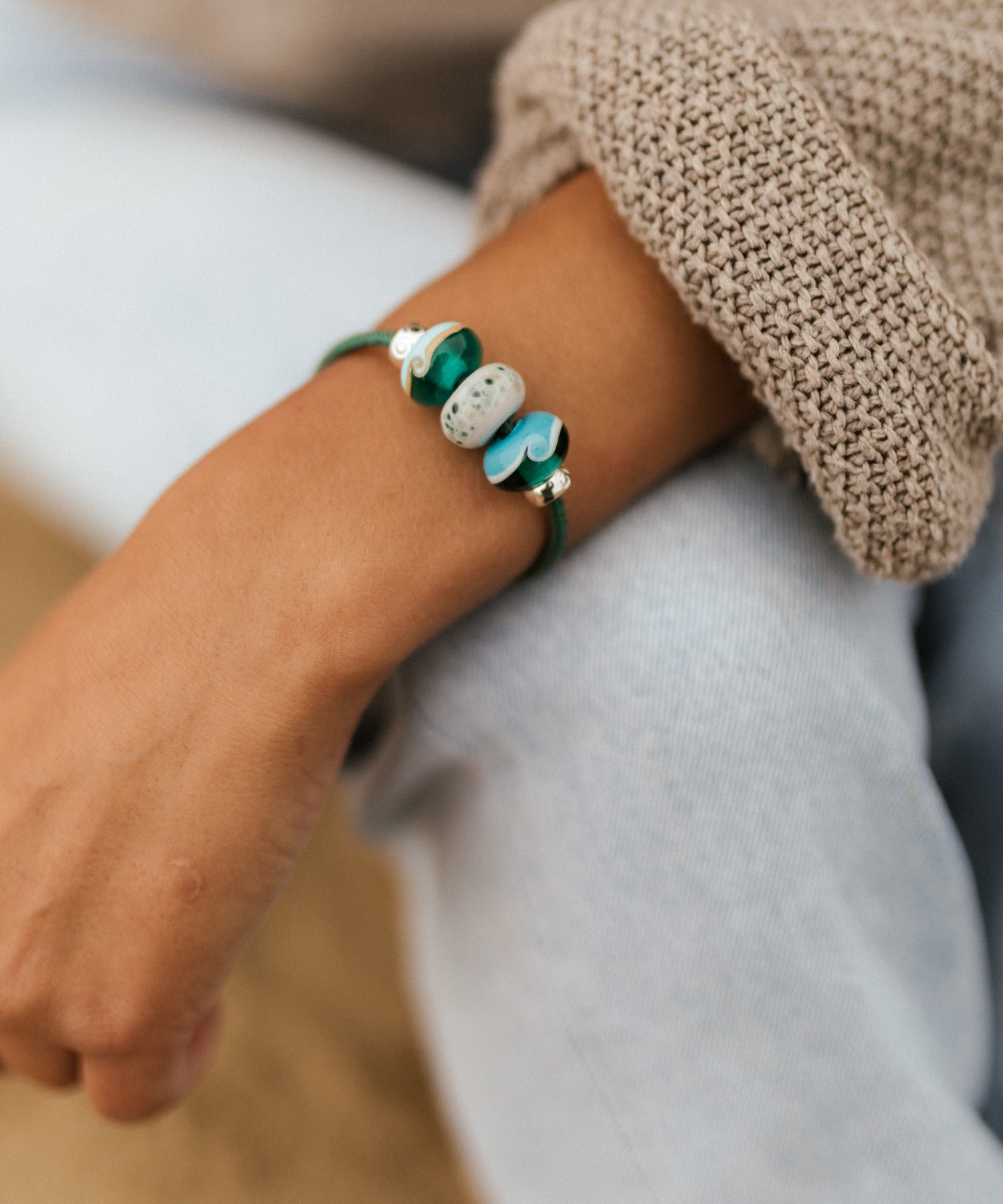 Nalu charity bead jewellery bracelet in blues and green glass beads.